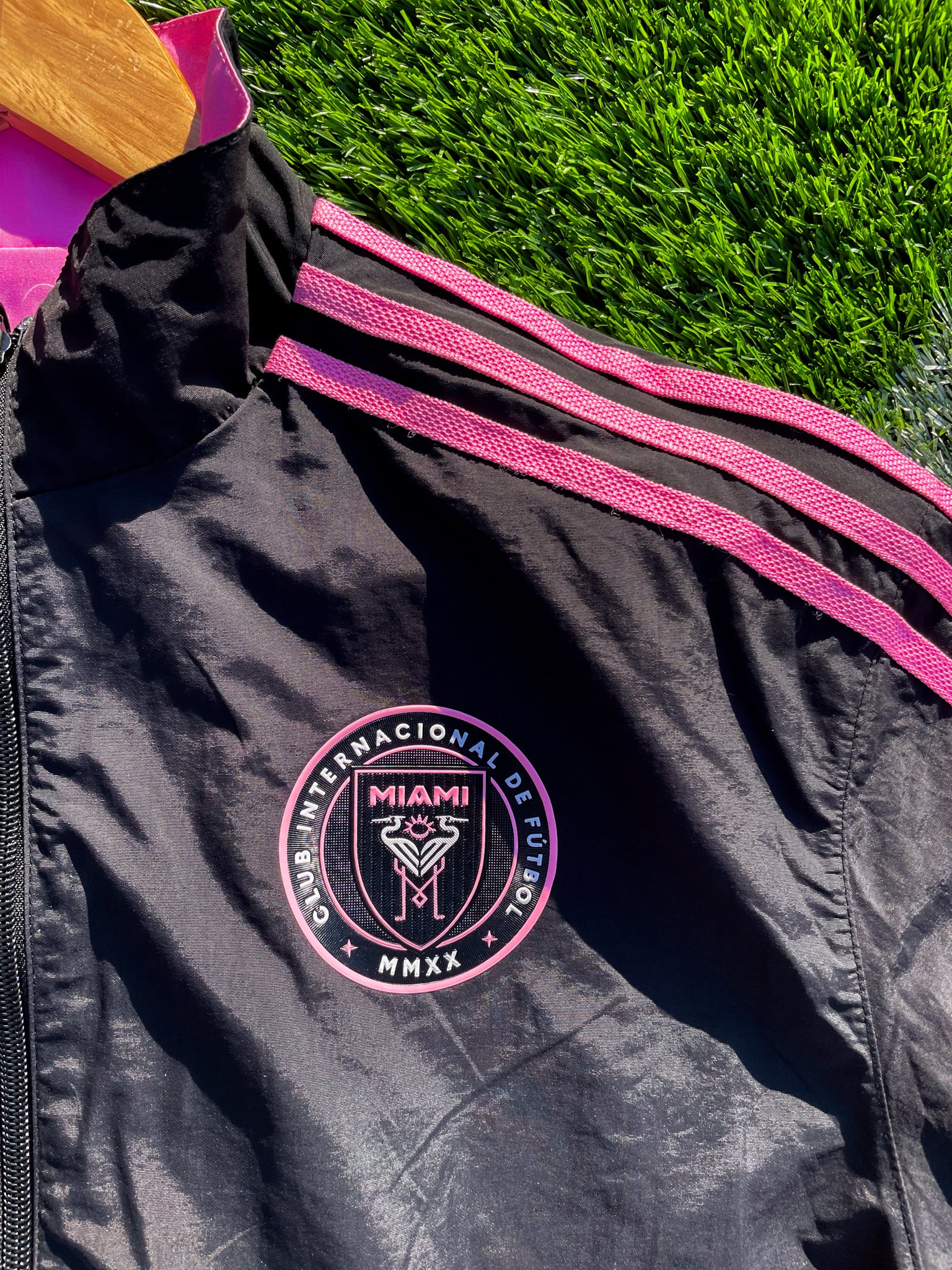 Close-up of Inter Miami logo and fabric texture on pink side

