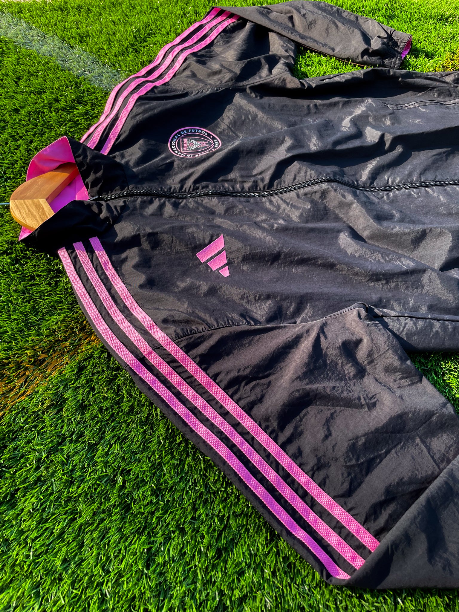 Close-up of Inter Miami logo and fabric texture on pink side


