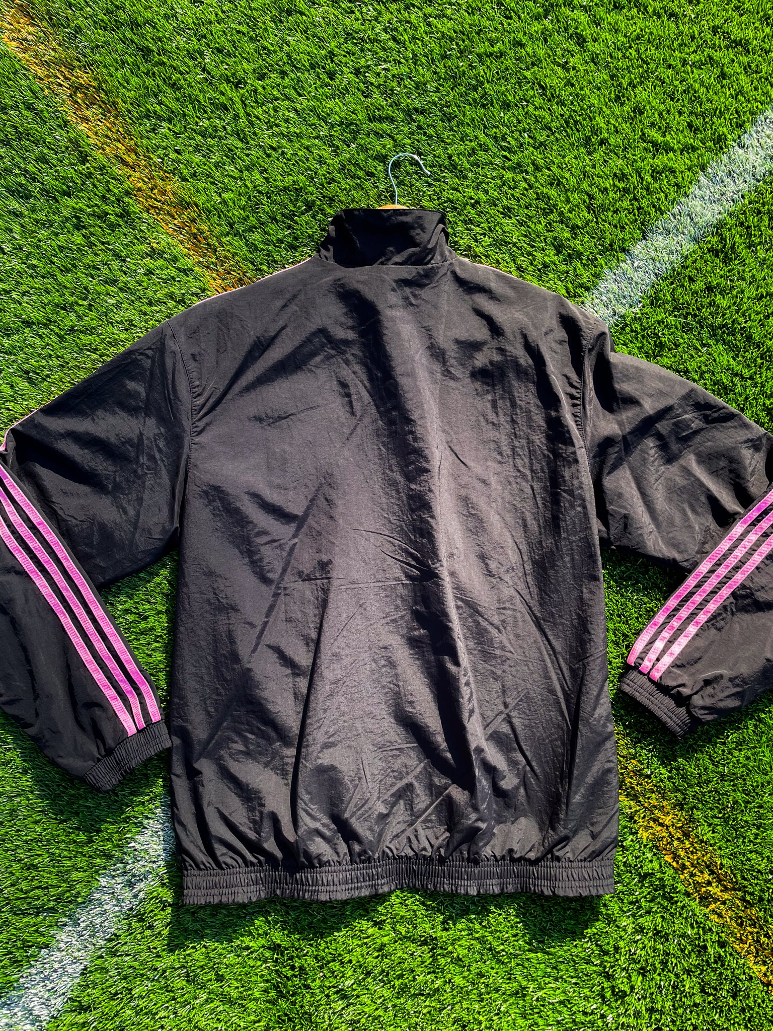 Close-up of Inter Miami logo and fabric texture on pink side

