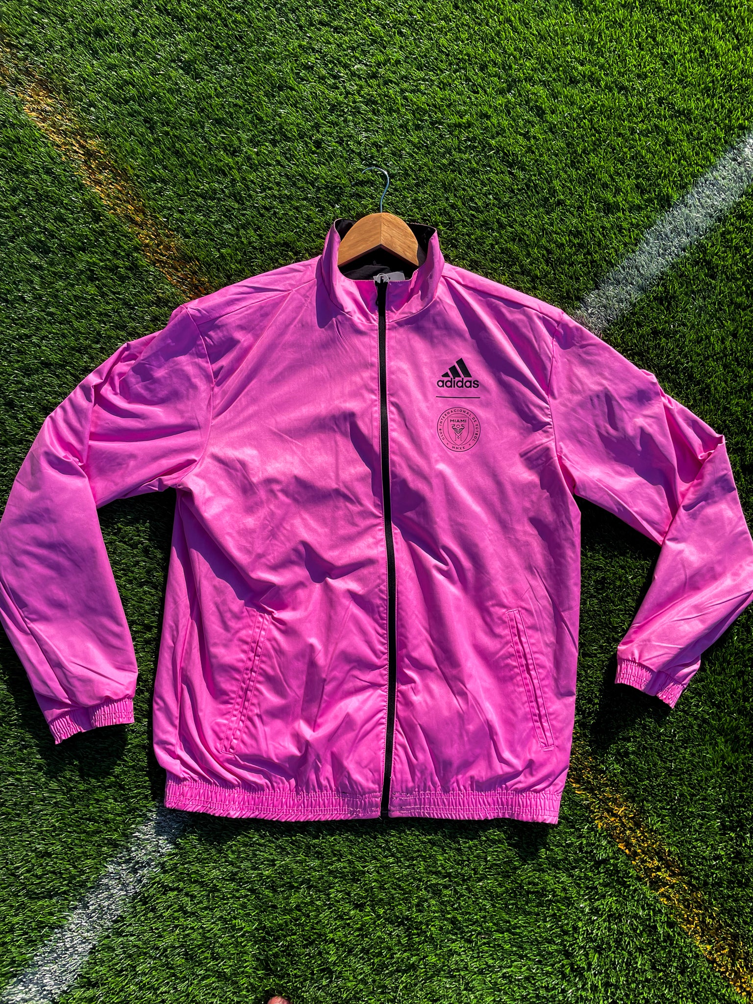 Flat lay of both sides of the reversible windbreaker side-by-side

