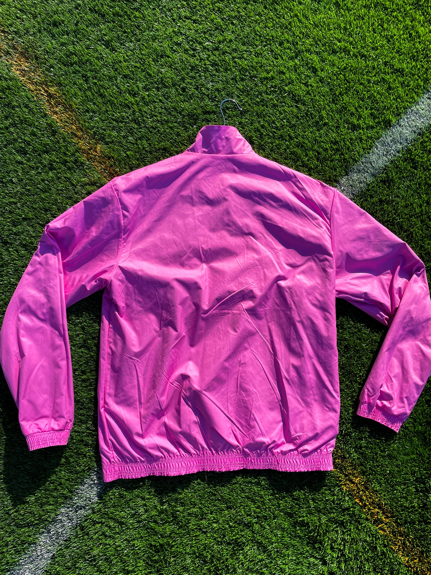 Flat lay of both sides of the reversible windbreaker side-by-side

