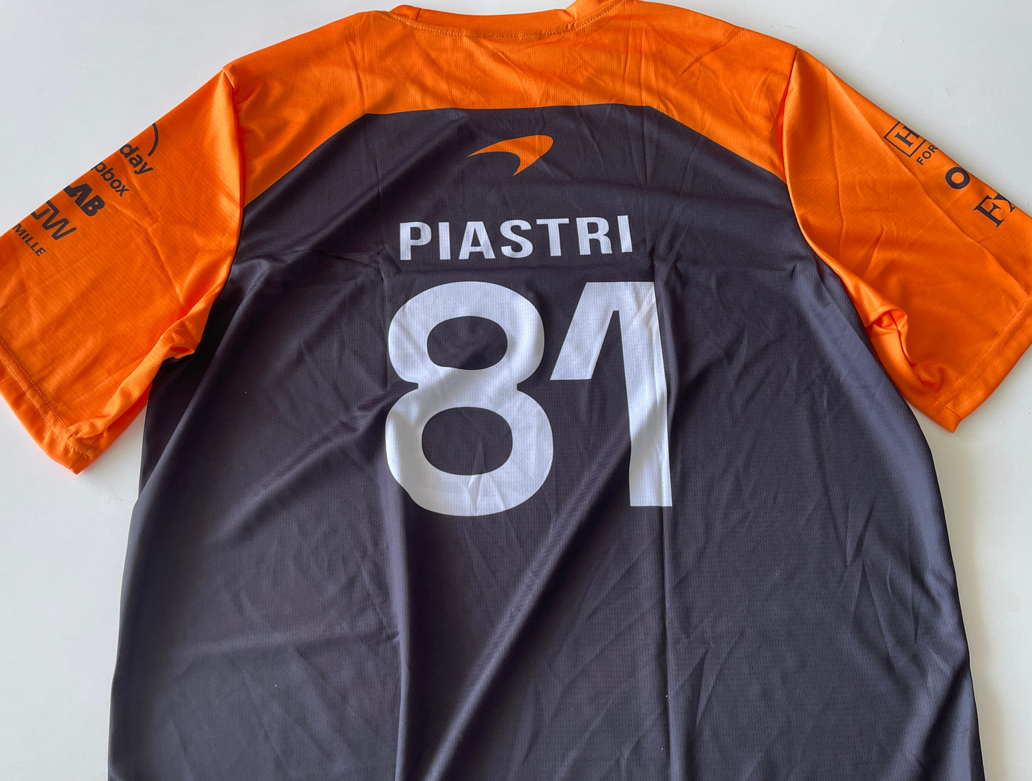 McLaren Formula 1 Black Jersey – Norris 4/ Piastri 81 - Orange Sleeves Racing Design