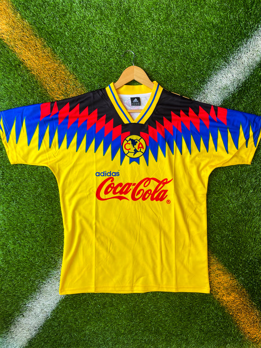 Front view of Club América 1994/1995 Home Jersey in yellow with Coca-Cola logo

