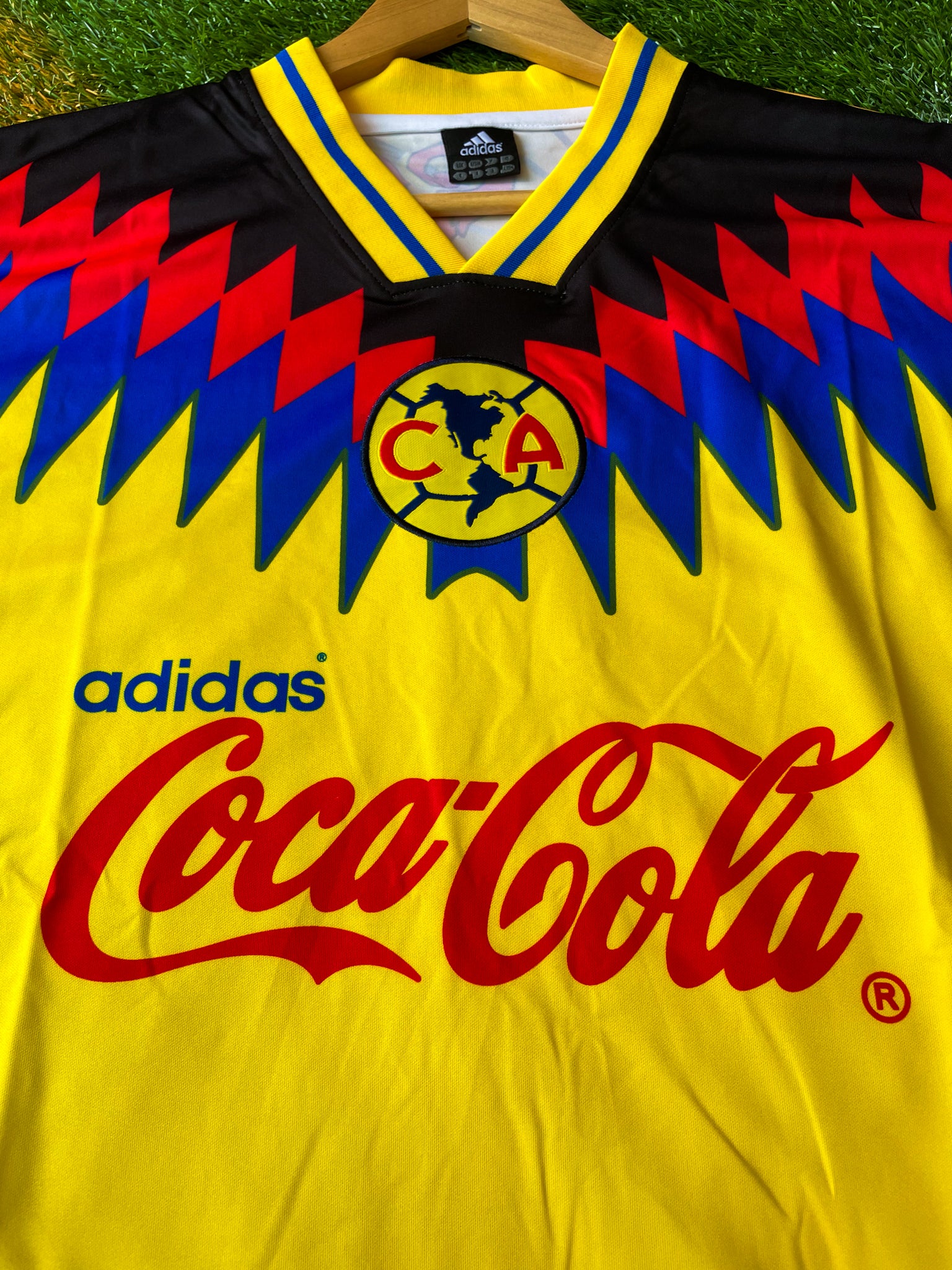 Close-up of sponsor logo and blue accents on jersey

