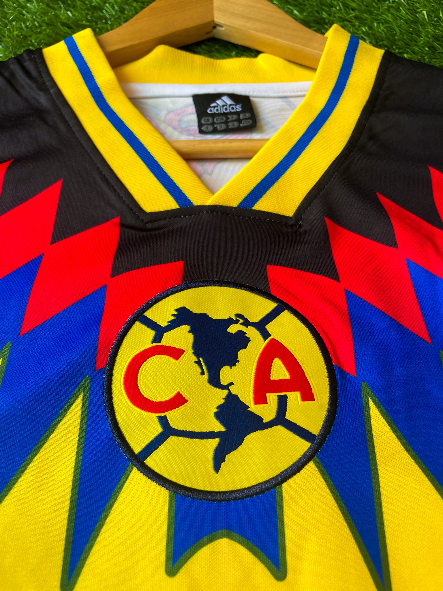 Close-up of sponsor logo and blue accents on jersey

