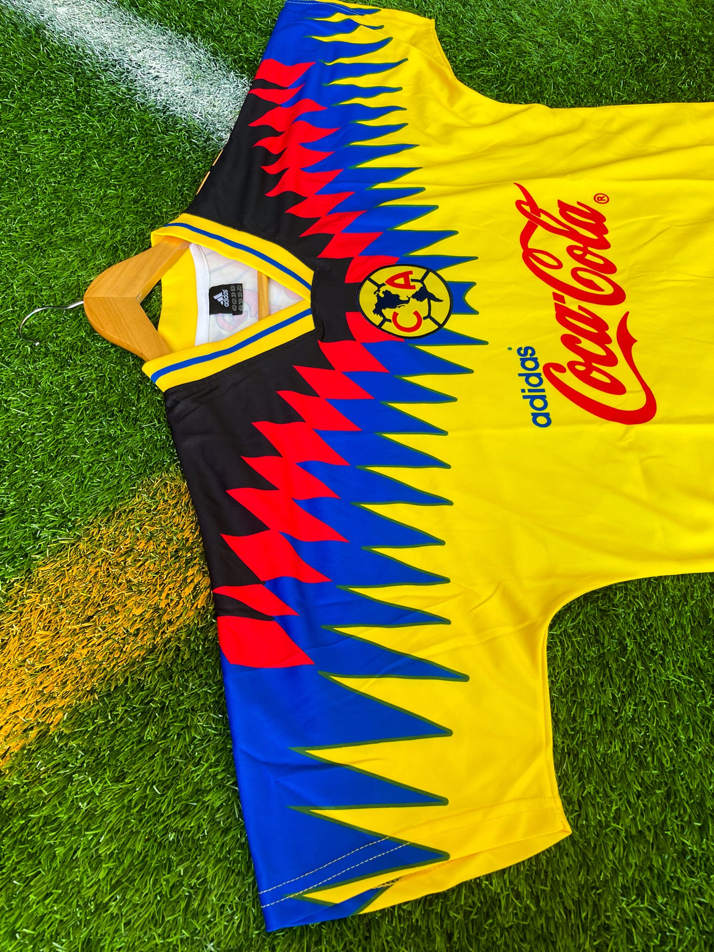 Close-up of sponsor logo and blue accents on jersey

