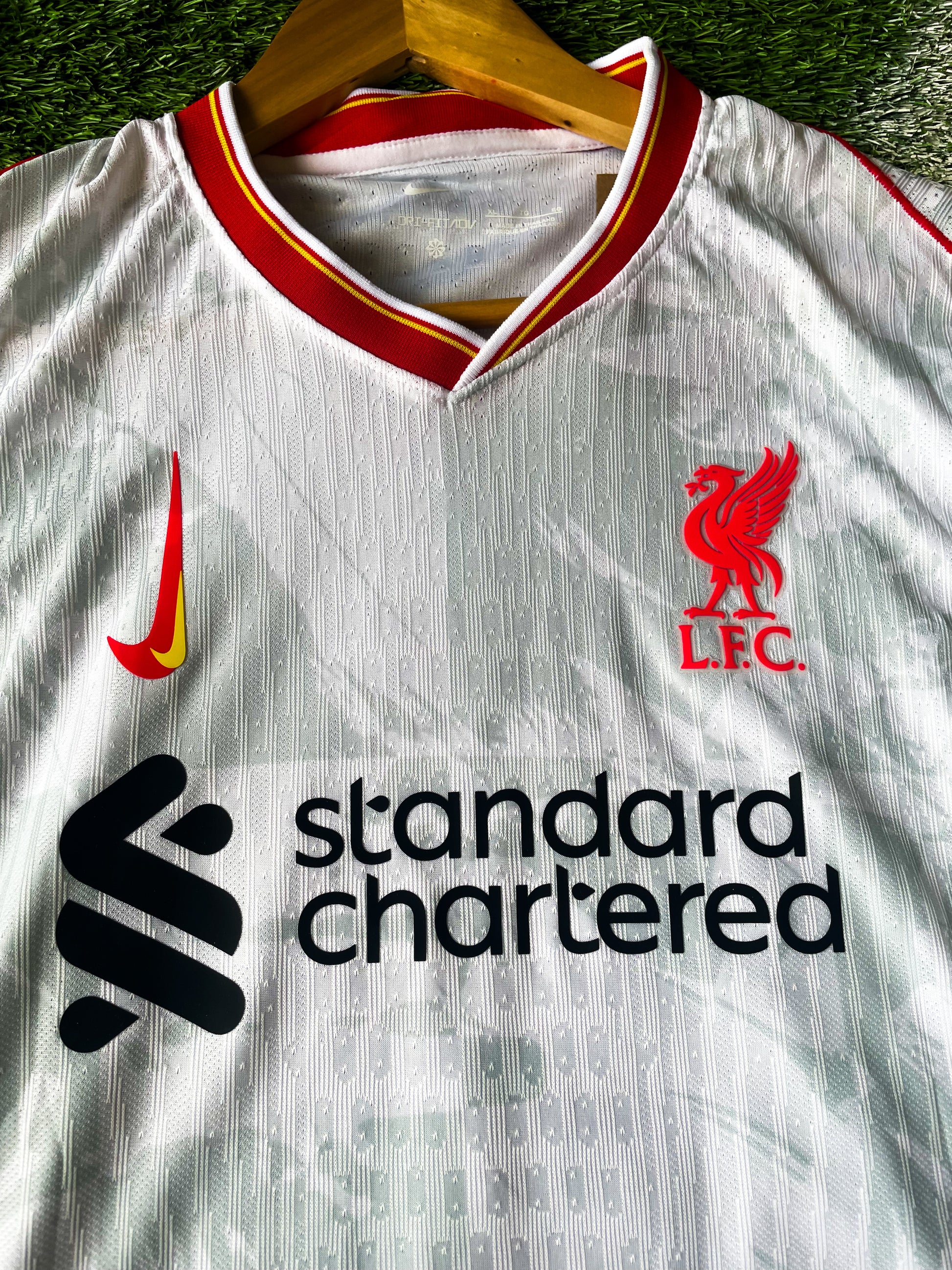 Close-up of Liverpool crest and Premier League Champions badge

