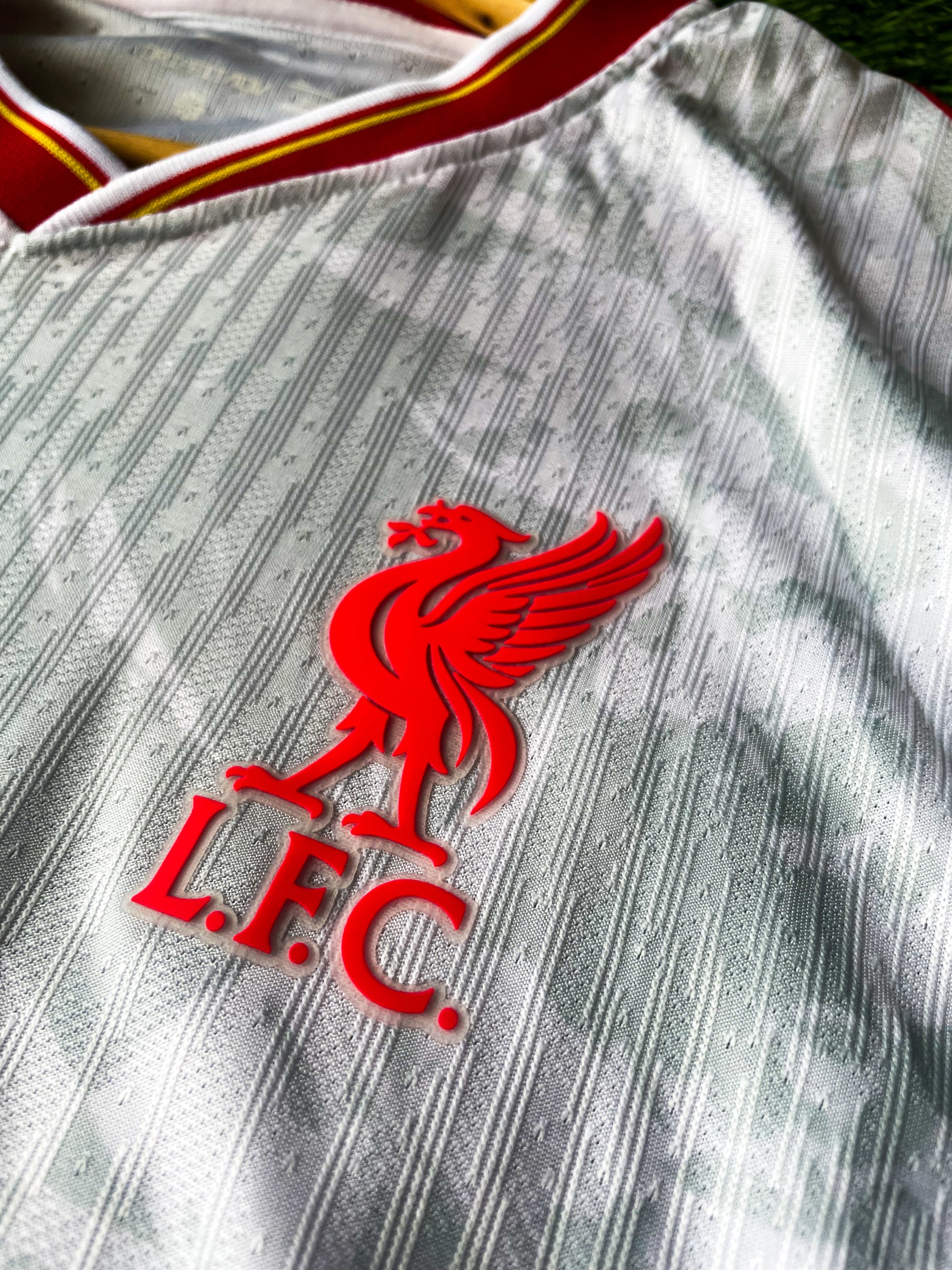 Close-up of Liverpool crest and Premier League Champions badge

