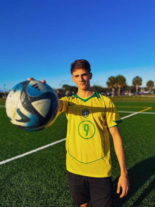 Model wearing the Brazil 2004 Home Ronaldo and Ronaldinho jersey