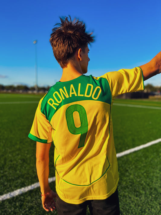 Model wearing the Brazil 2004 Home Ronaldo and Ronaldinho jersey