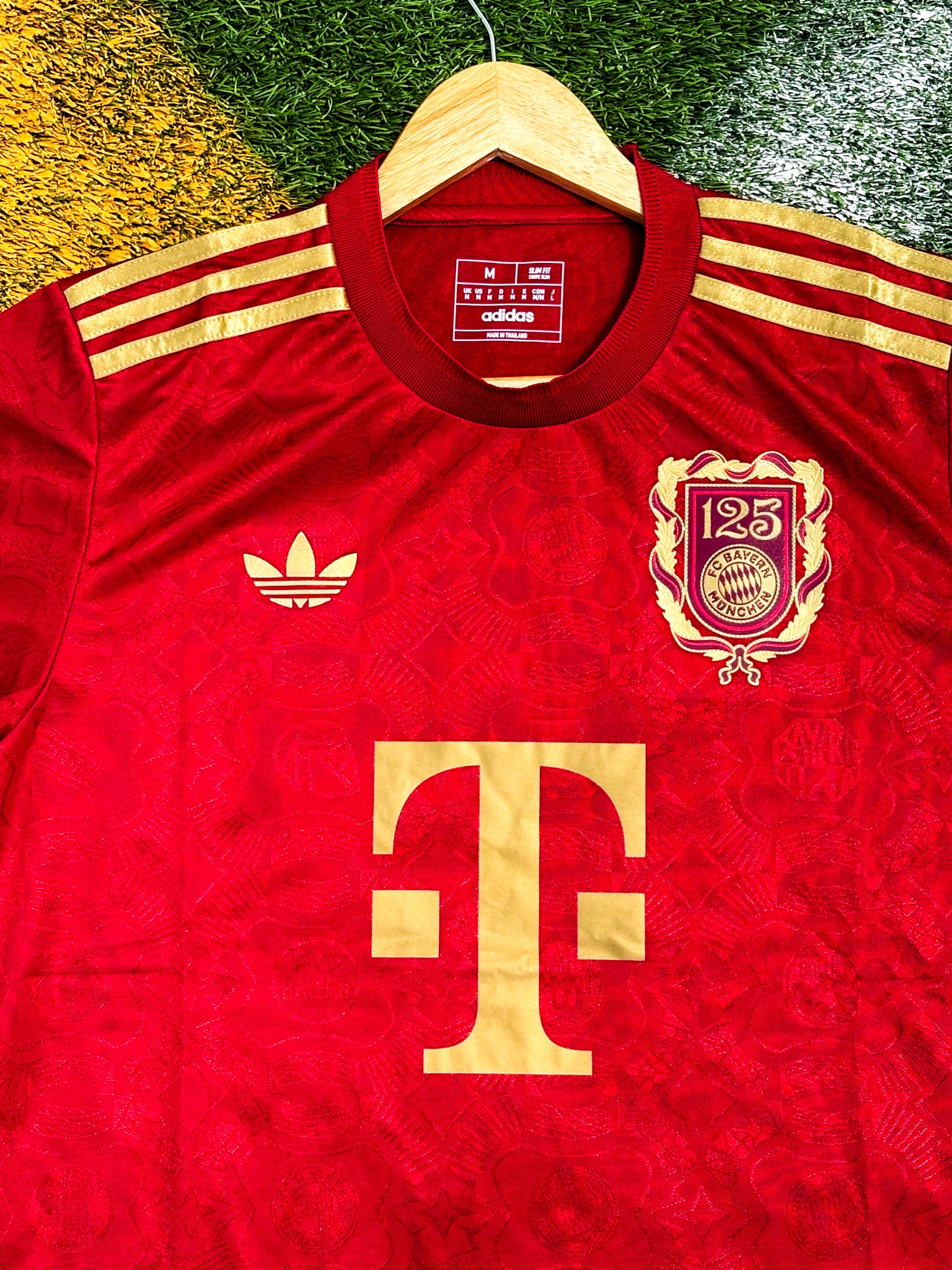 Close-up of Bayern Munich club crest and anniversary badge

