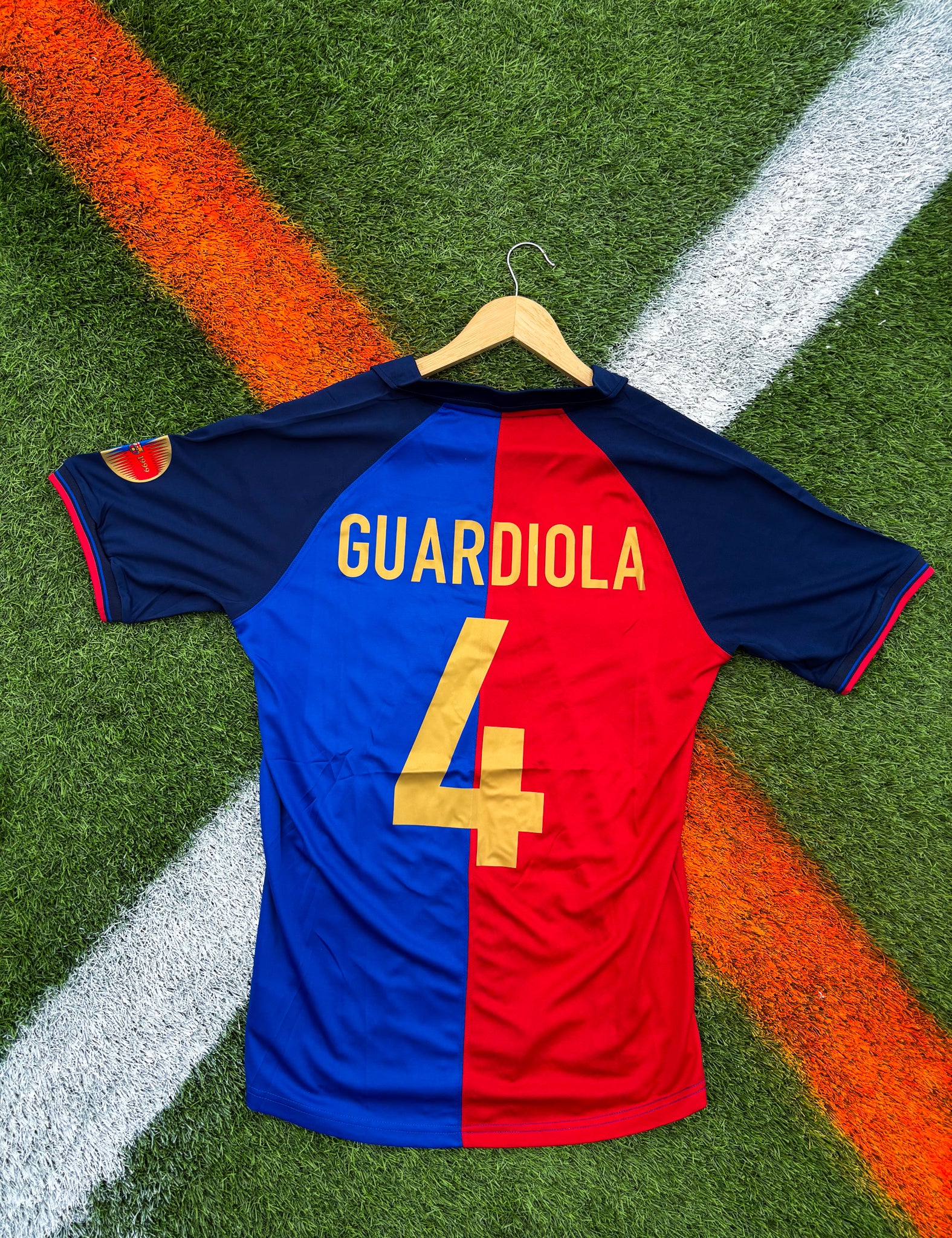 Back of the jersey showing classic red and blue stripes featuring guardiola #4

