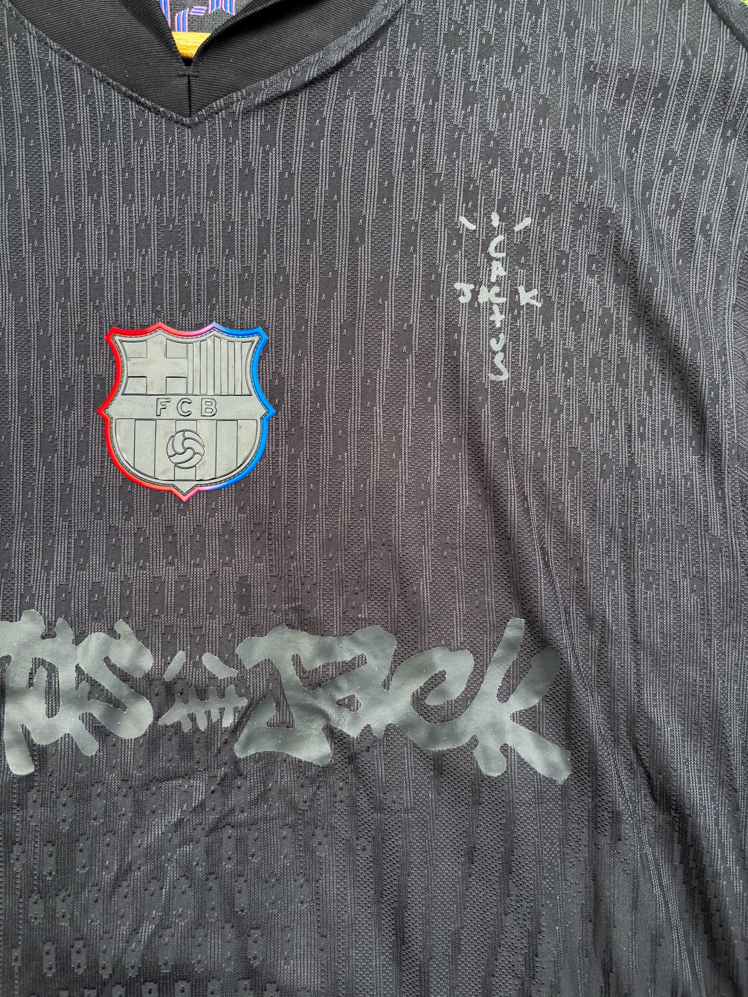 Close-up of fabric texture and embroidered crest, reminiscent of premium Cactus Jack merch styling
