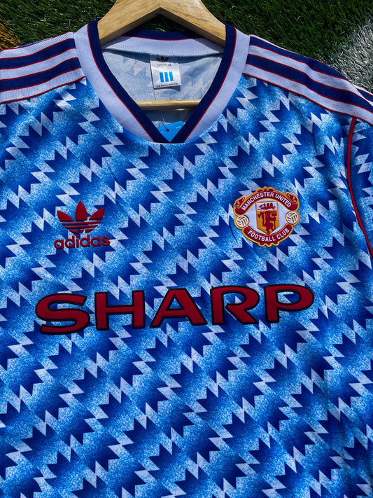 Close-up view of the vintage Adidas jersey design

