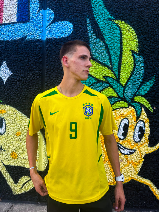 Model wearing the Brazil 2002 Ronaldo & Ronaldinho jerseys styled with sneakers