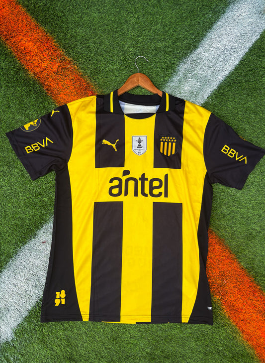 Peñarol 2025 Home Jersey – Arezo #19 – Classic Stripes by Puma