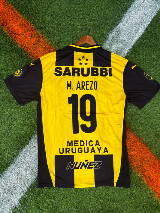 Peñarol 2025 Home Jersey – Arezo #19 – Classic Stripes by Puma