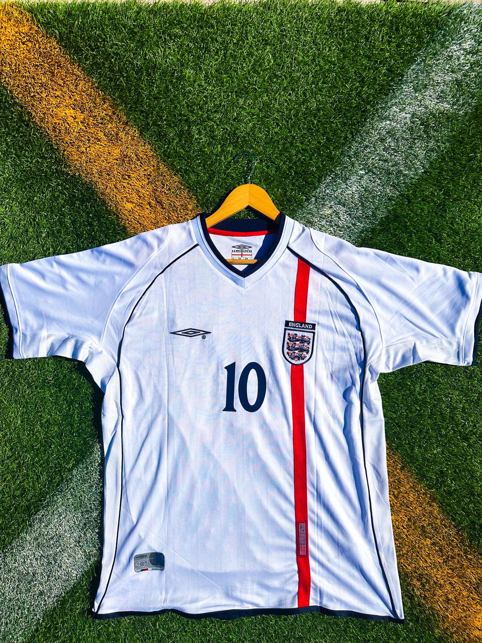 Front view of England 2002 Owen #10 retro jersey with classic design.