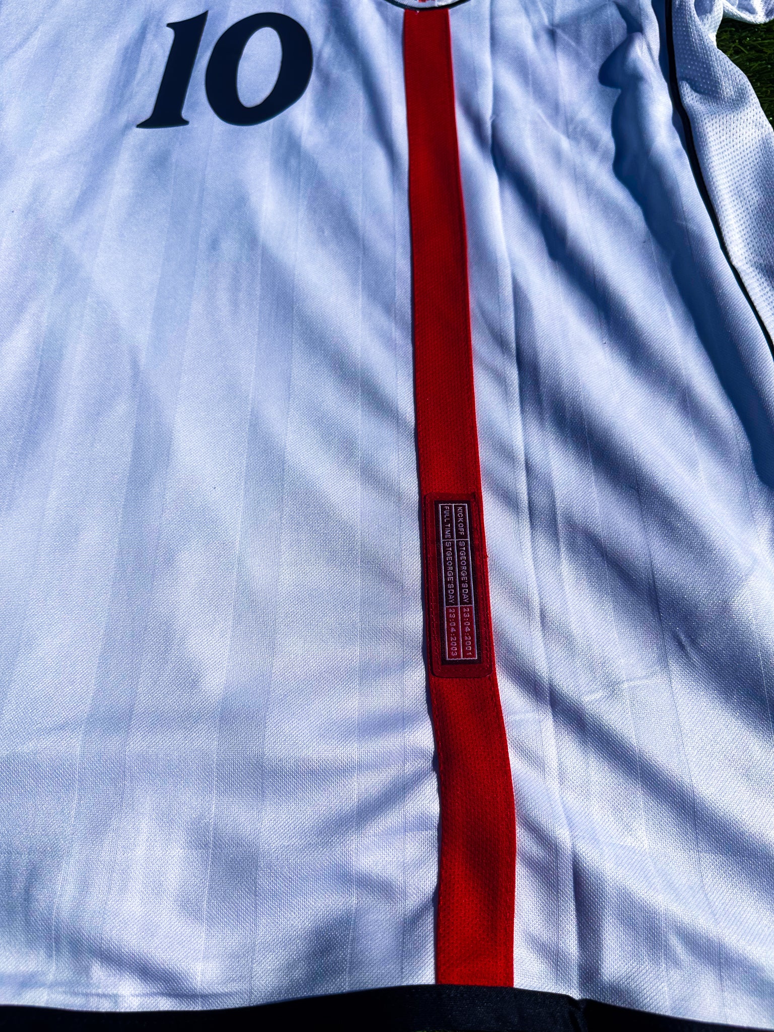 Close-up of the England crest and jersey fabric details.