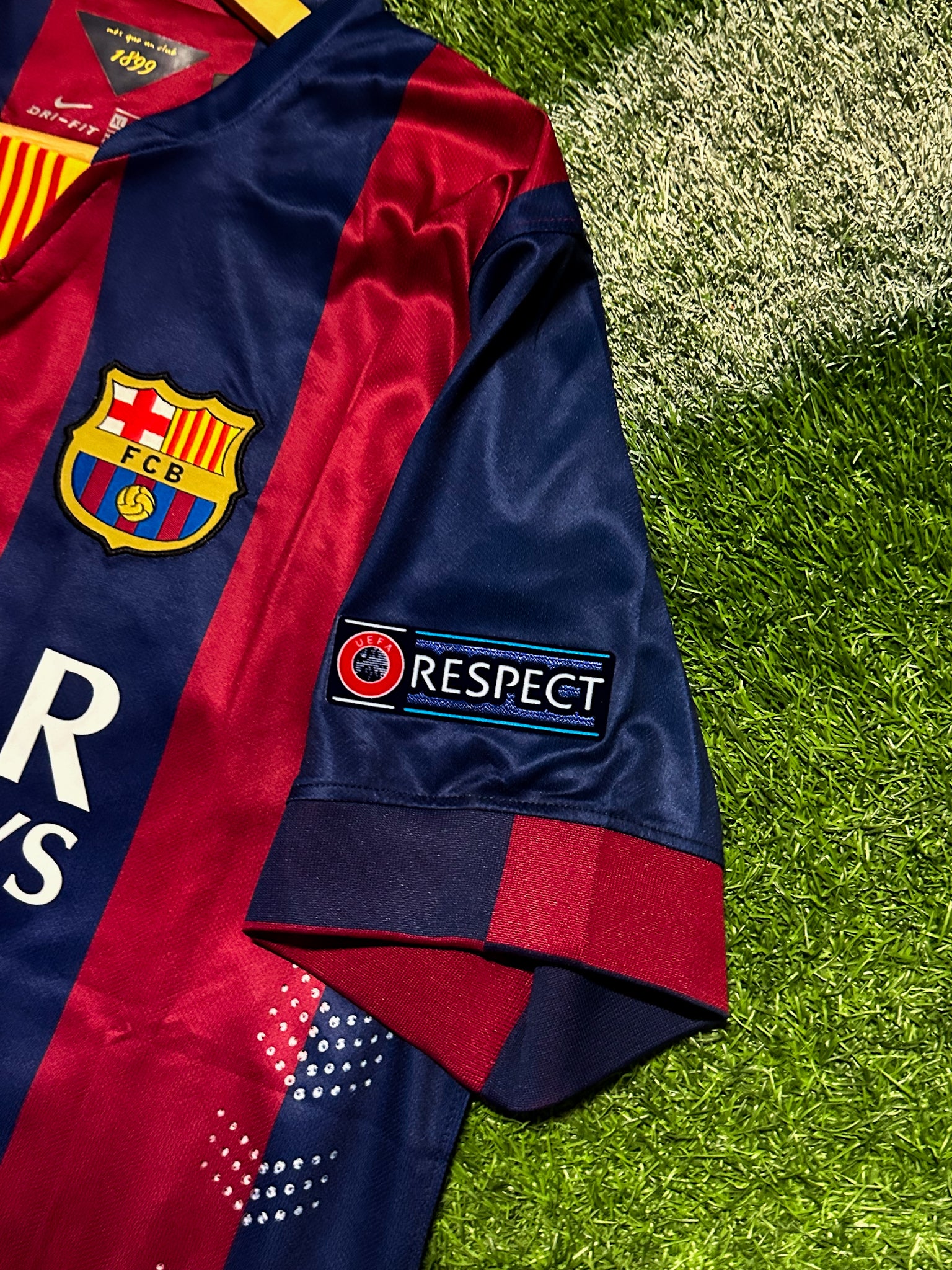 FC Barcelona 2014-15 home jersey with classic red and blue stripes, embroidered crest, and "Respect" patch.