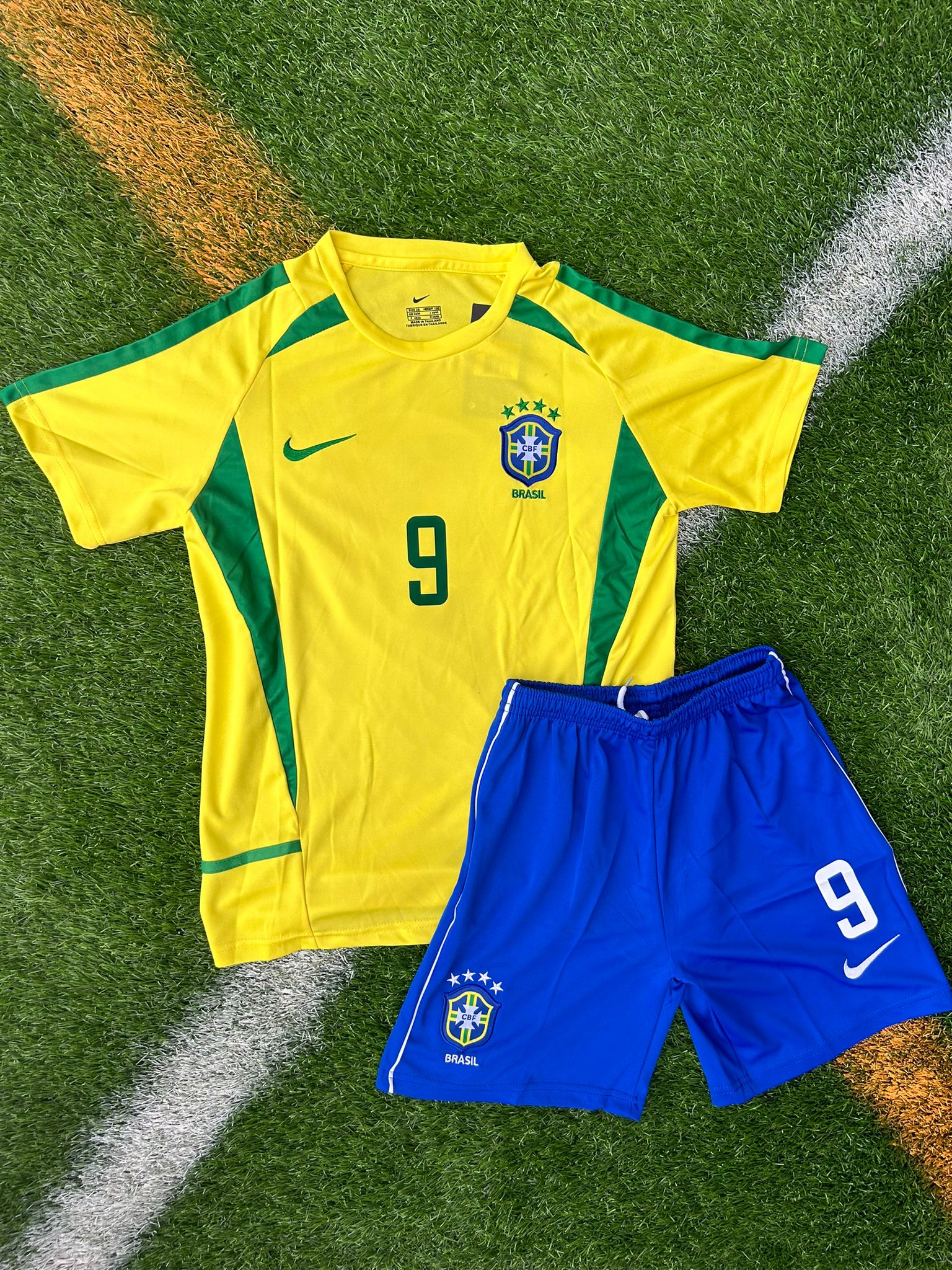 Front view of Brazil 2002 Kids Jersey with retro Nike logo