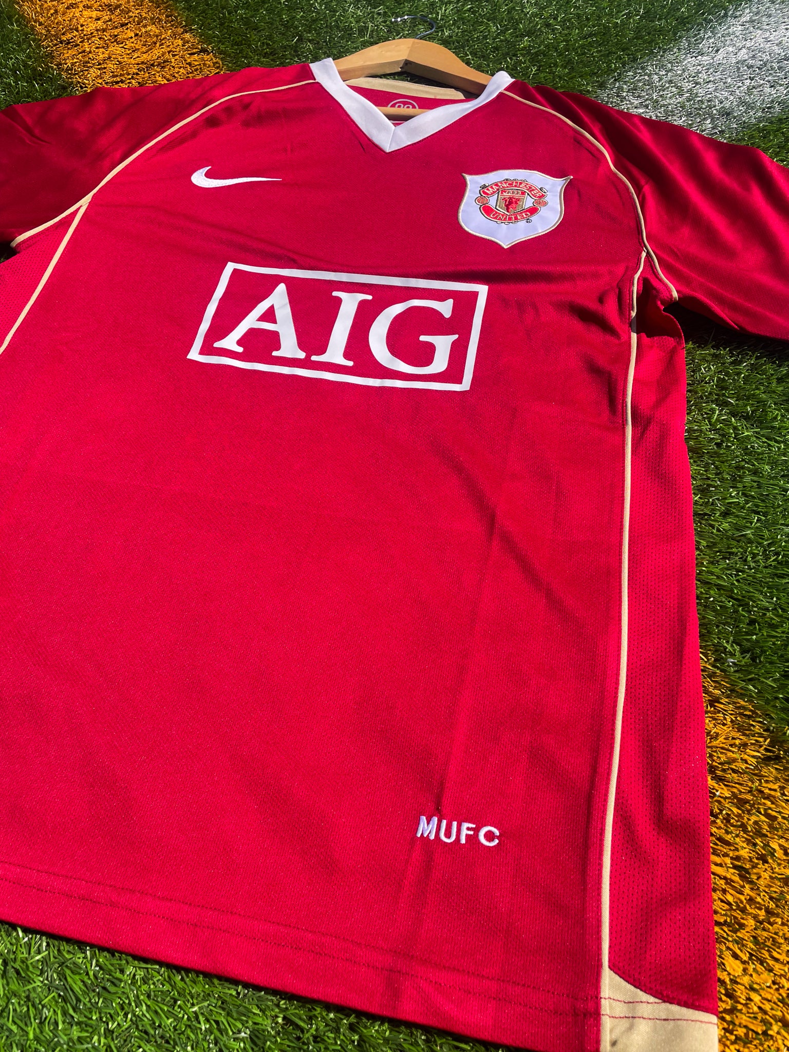 Close-up of Nike swoosh and embroidered crest

