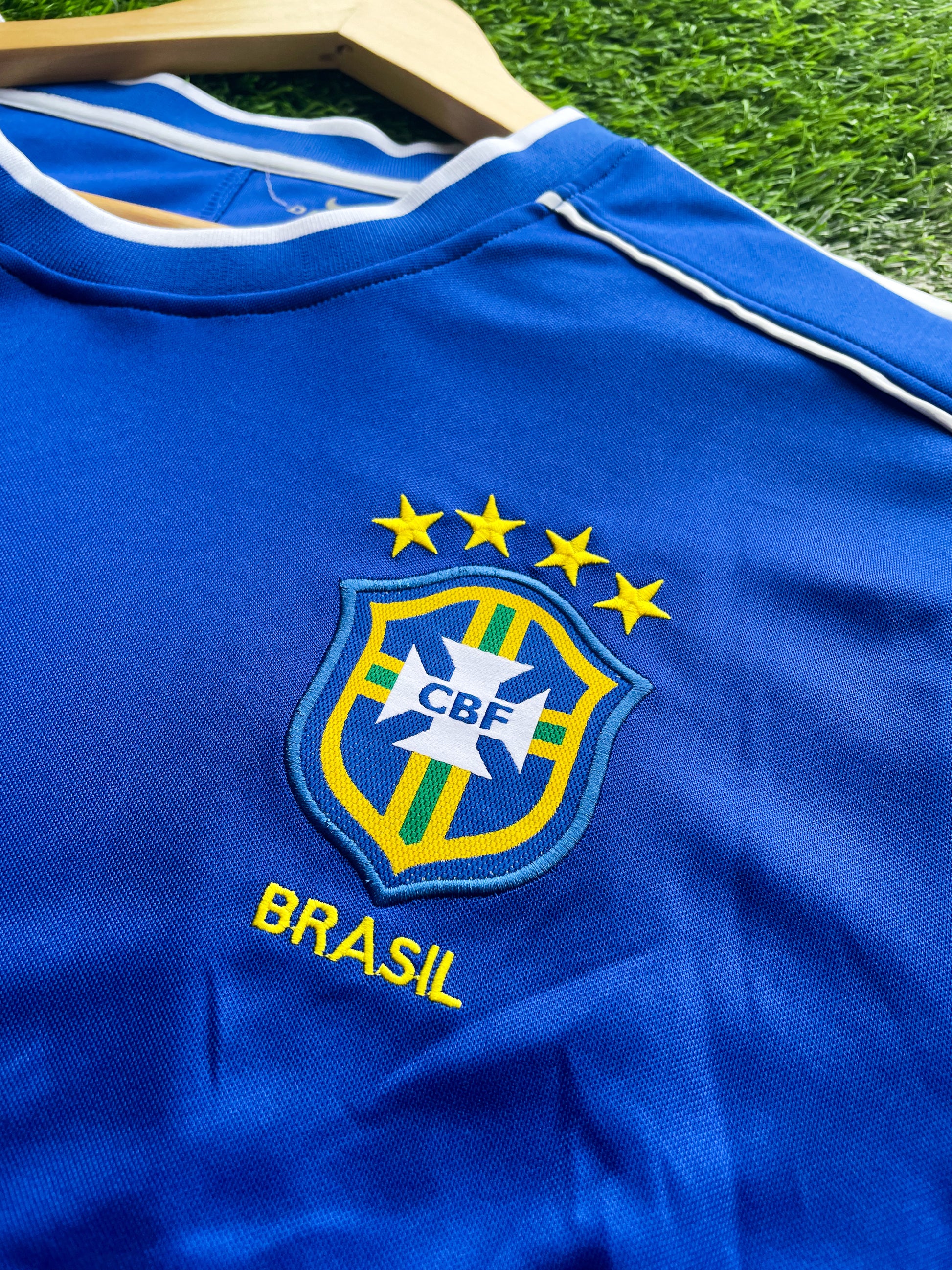 Detail shot of stitching and classic yellow trim on the vintage jersey