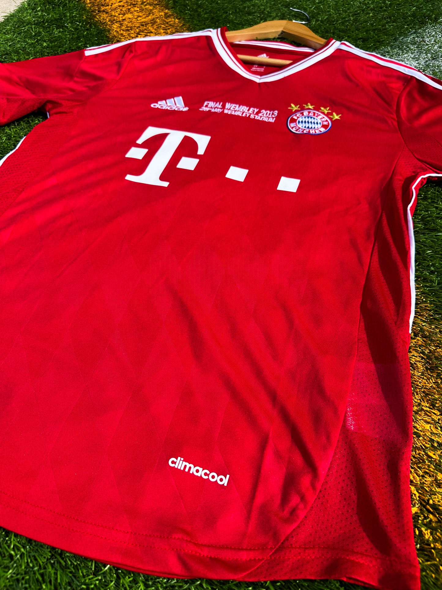 Close-up of Bayern crest and Champions League final detail

