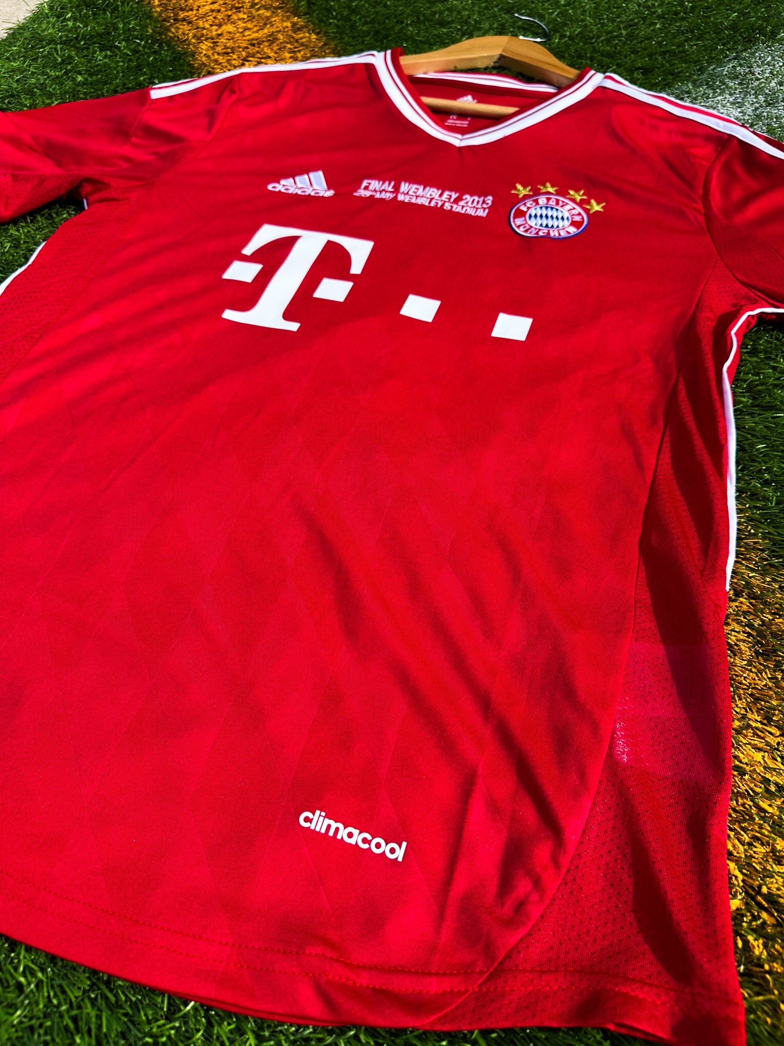 Close-up of Bayern crest and Champions League final detail

