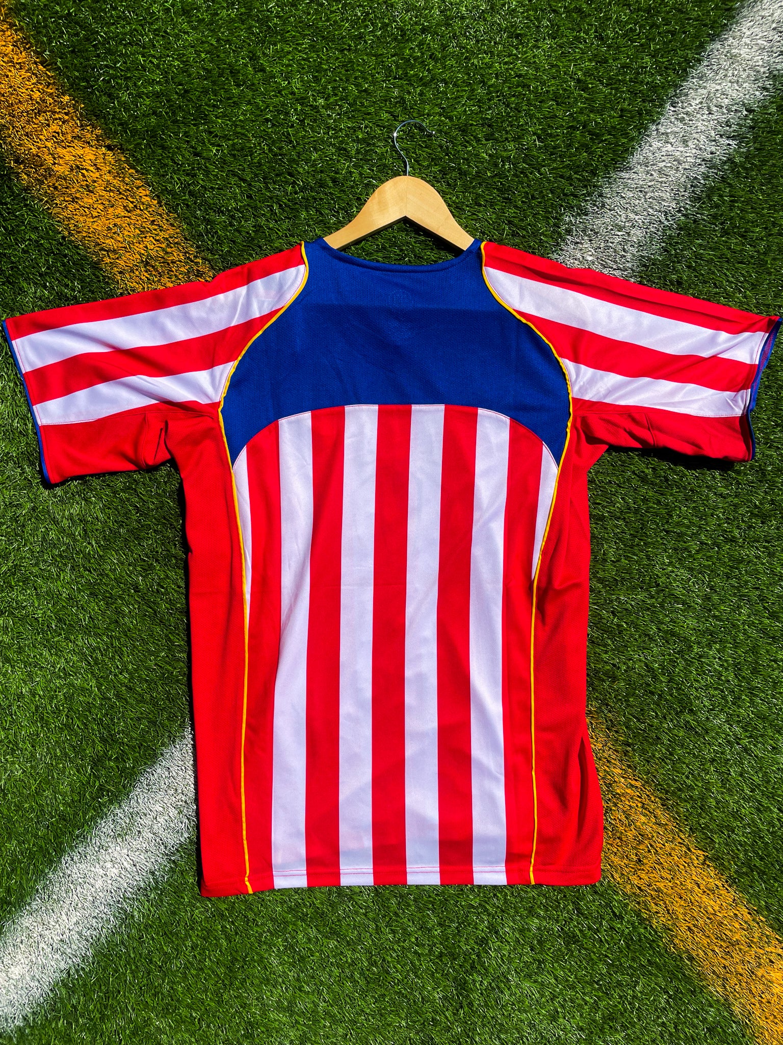 Back of jersey showing classic red and white stripes

