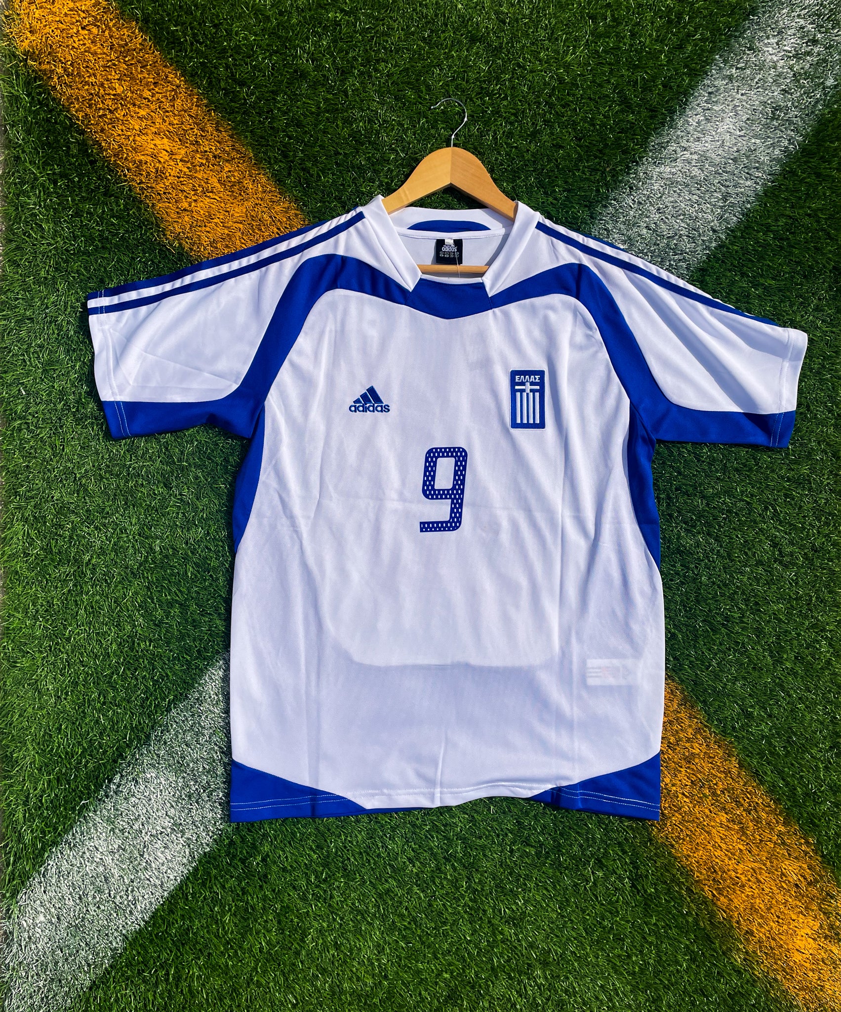 Front view of Greece 2004 home jersey in white and blue

