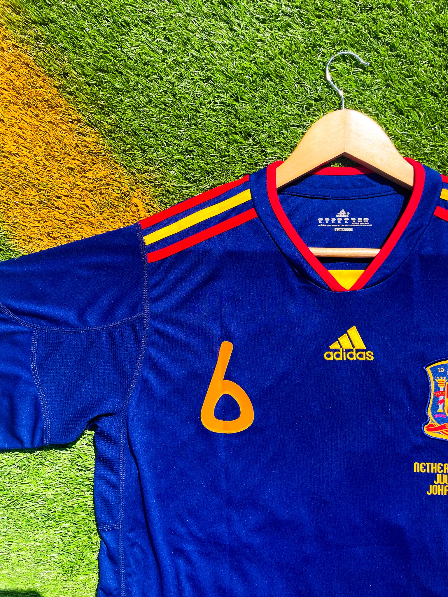 Detail shot of Spain crest and Adidas logo from 2010 Away kit

