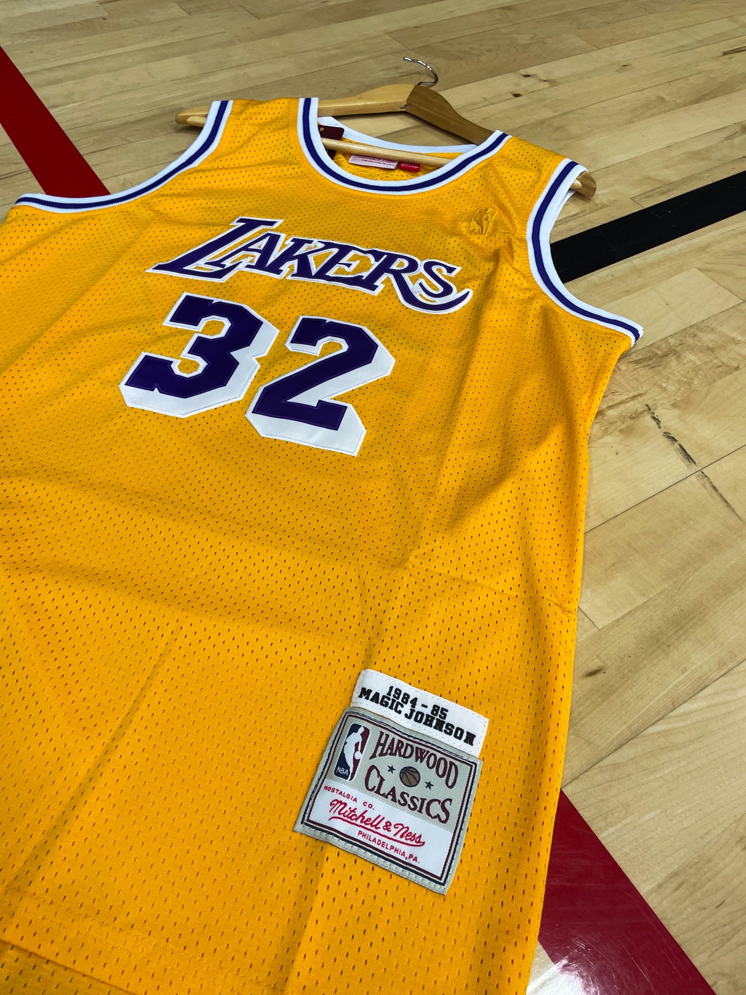 Close-up of Lakers logo and mesh fabric details with gold trim

