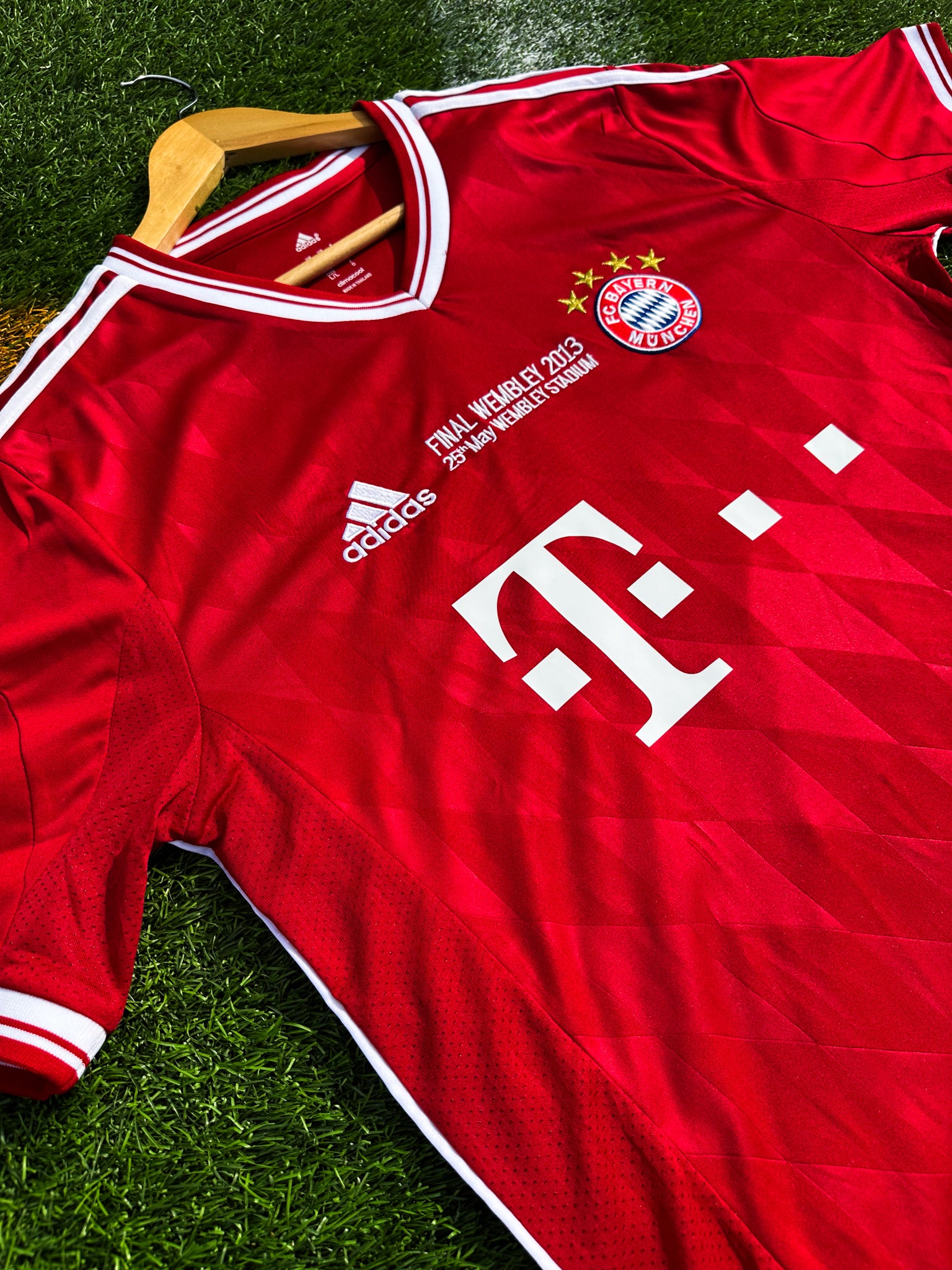 Close-up of Bayern crest and Champions League final detail

