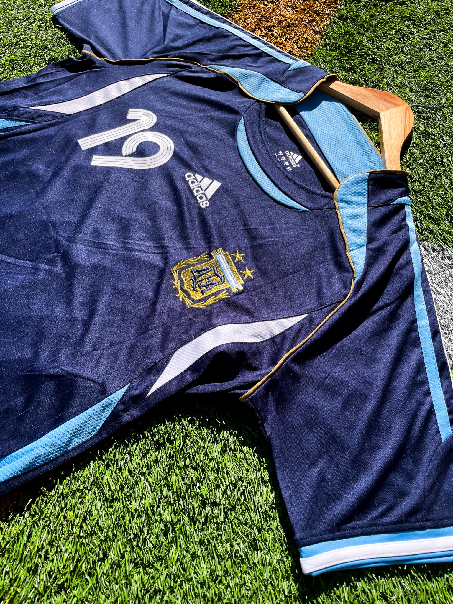 Front view of Argentina 2006 Away Jersey with Messi #19 and AFA crest.