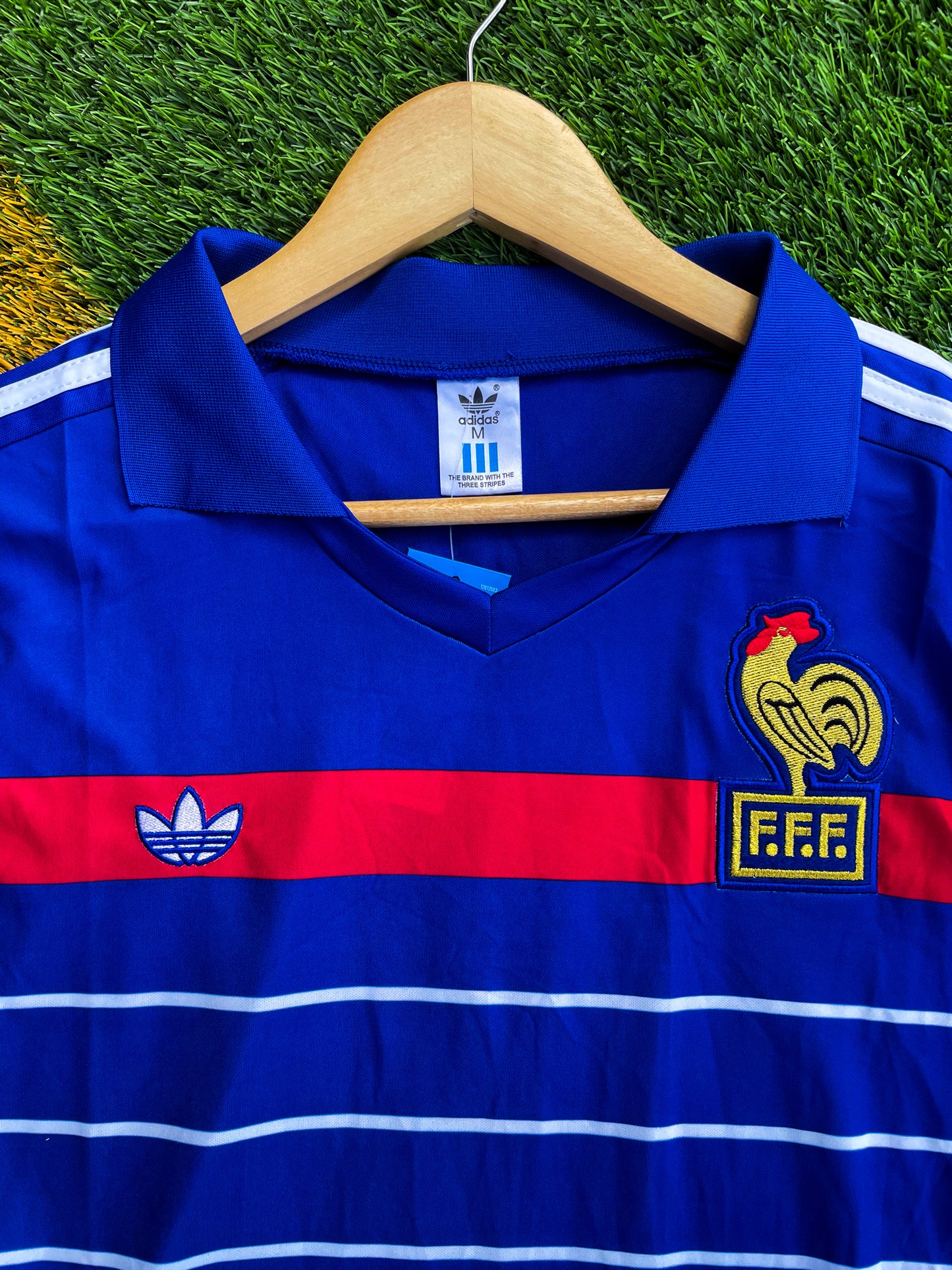 Close-up of FFF crest and Adidas trefoil on the jersey

