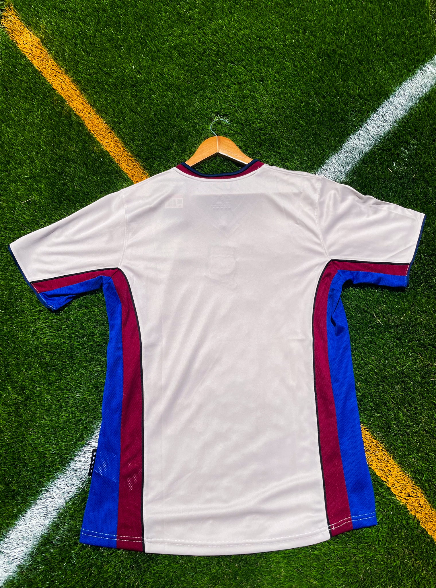 Back of the jersey showing light blue design details

