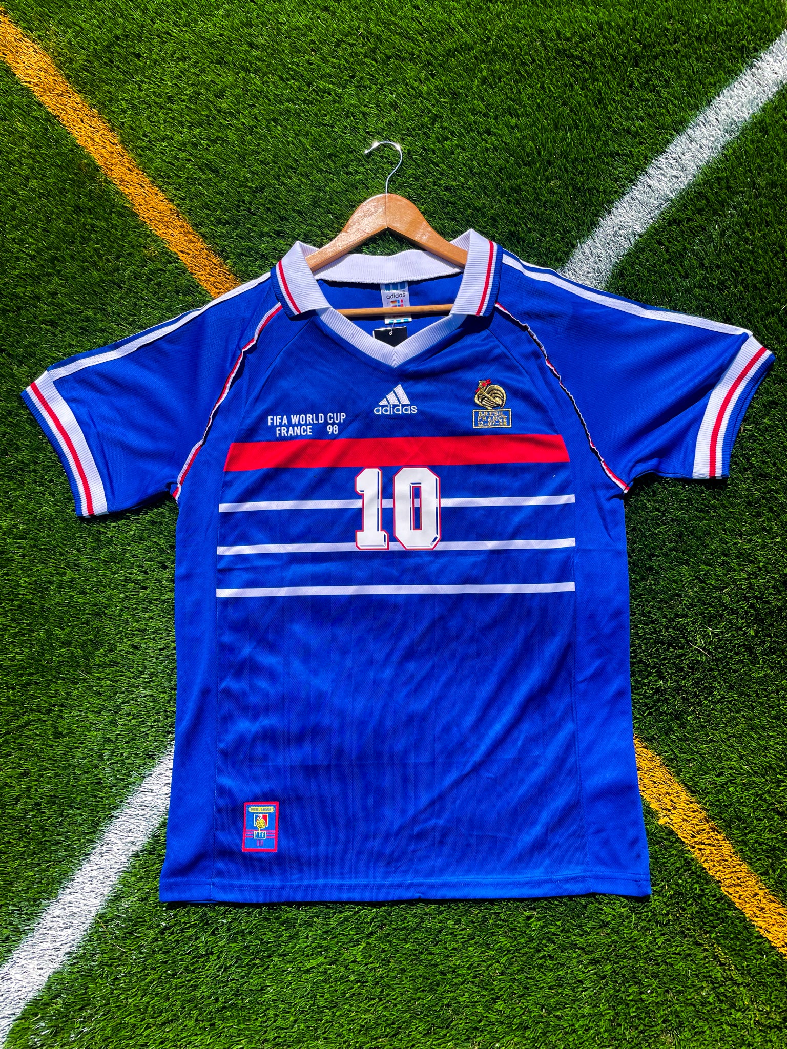 Front view of France 1998 home jersey featuring classic blue design and chest stripes