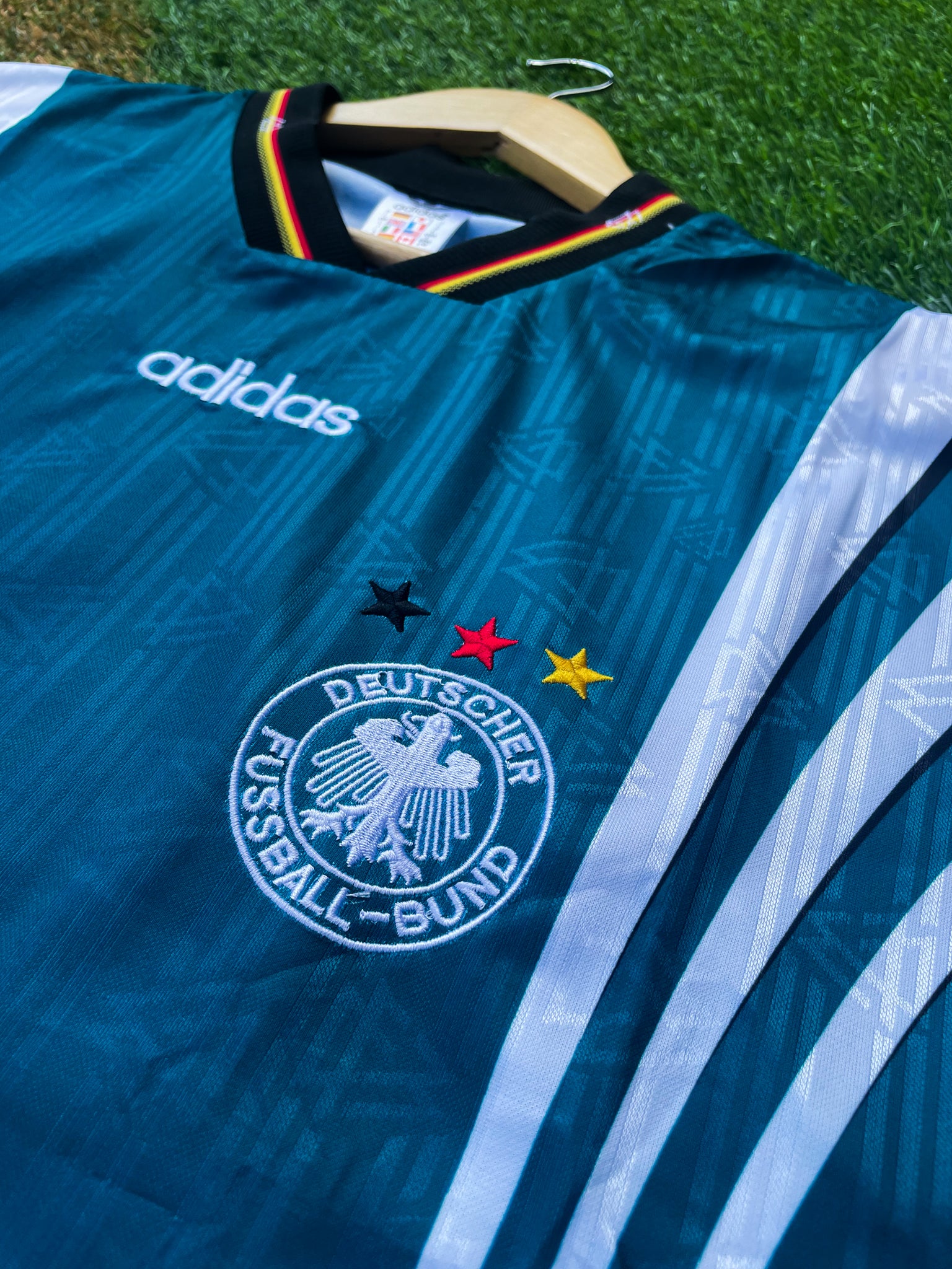 Close-up of DFB crest and Adidas logo

