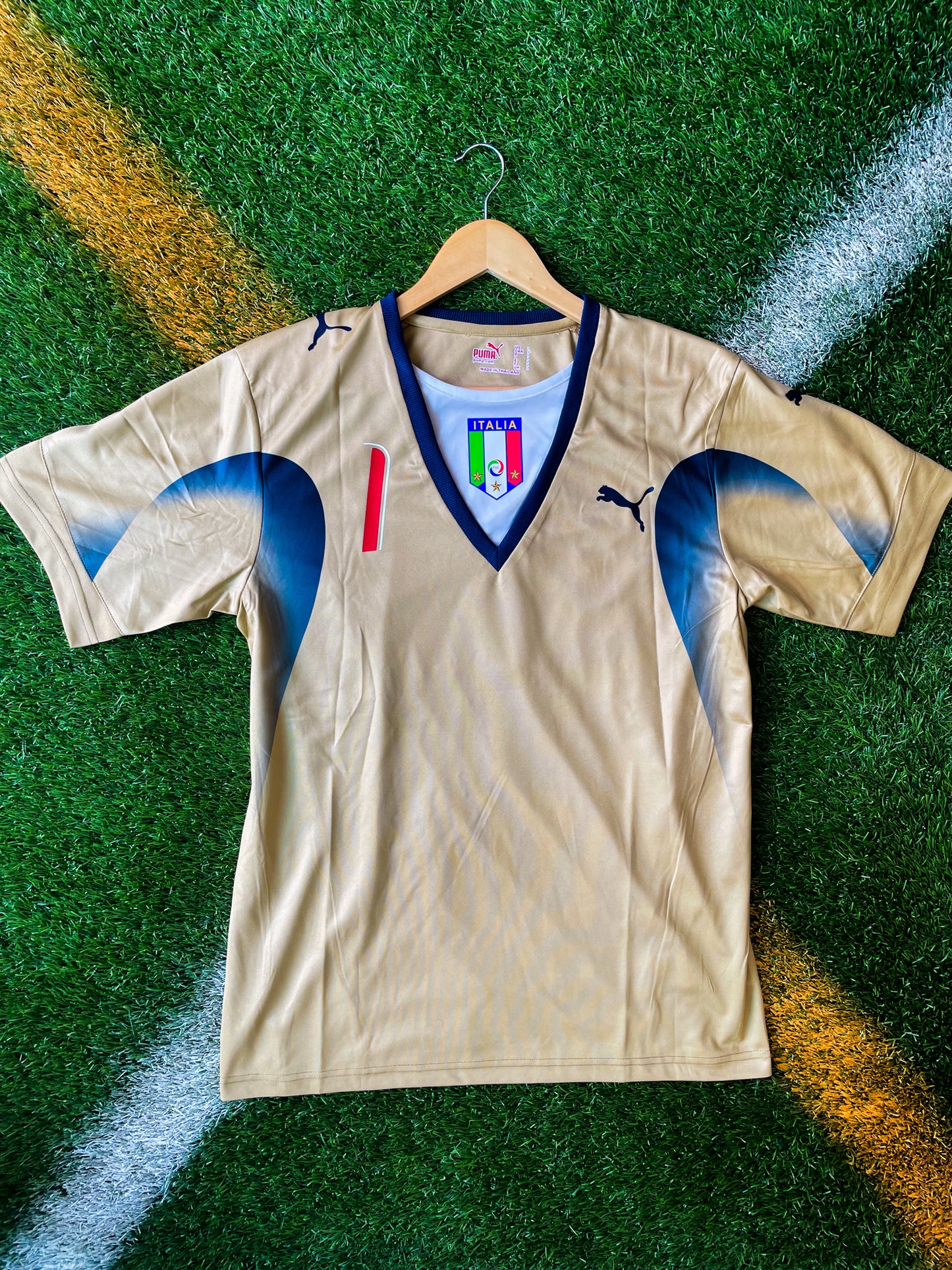 Front view of Italy 2006 goalkeeper jersey in green with crest

