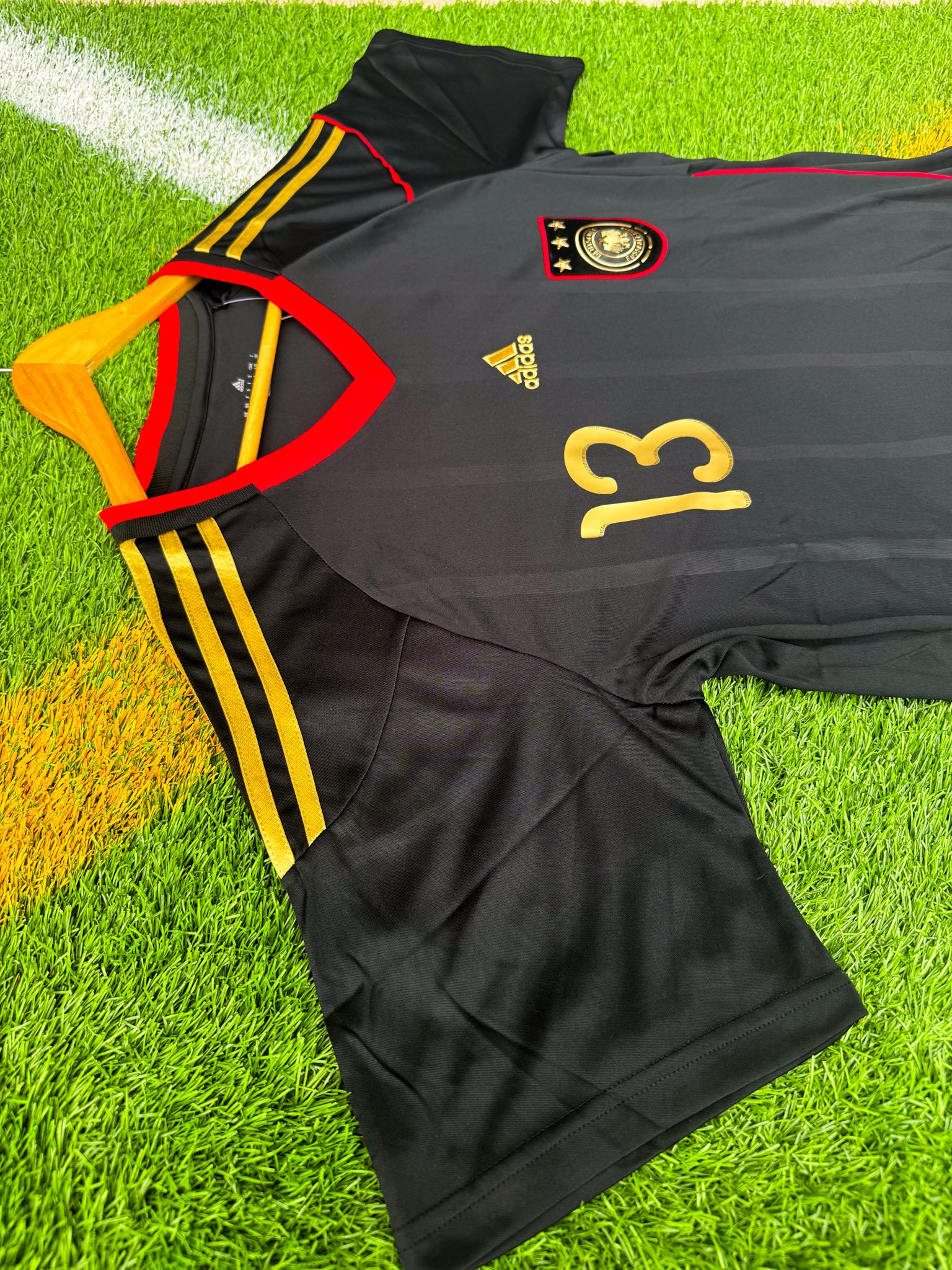 Close-up of Adidas logo and DFB crest


