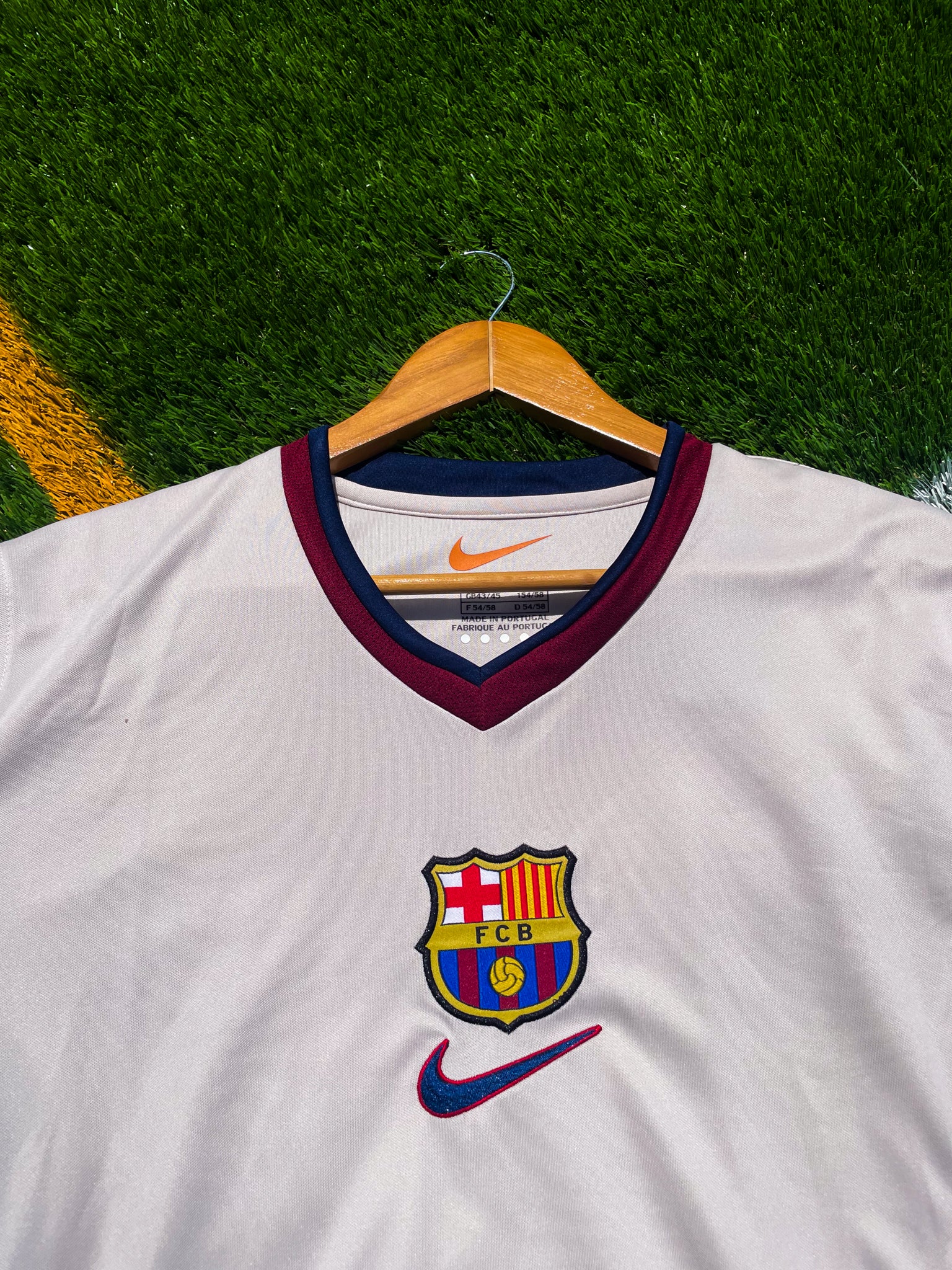 Close-up of Nike swoosh and Barcelona crest embroidery

