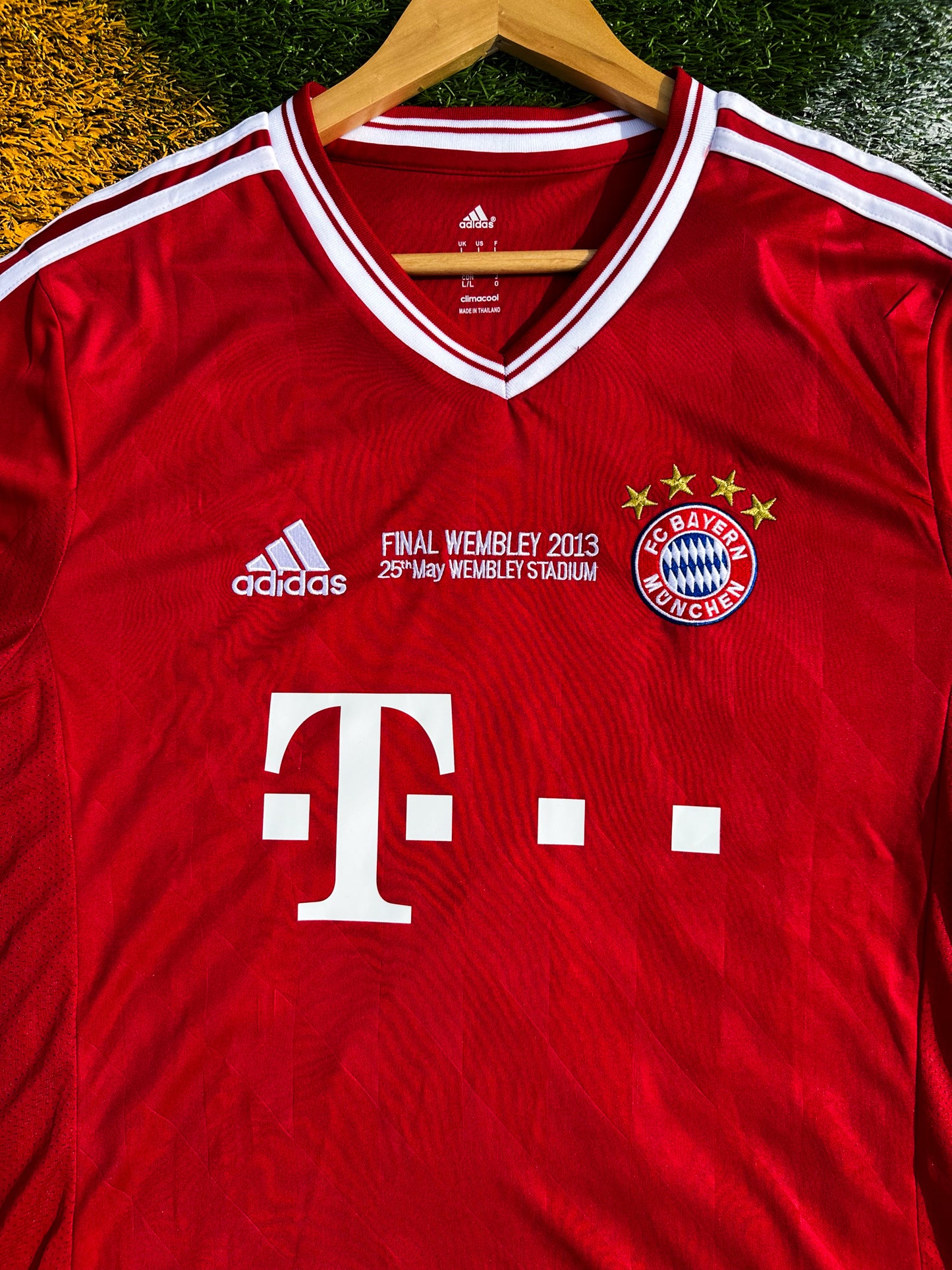Close-up of Bayern crest and Champions League final detail


