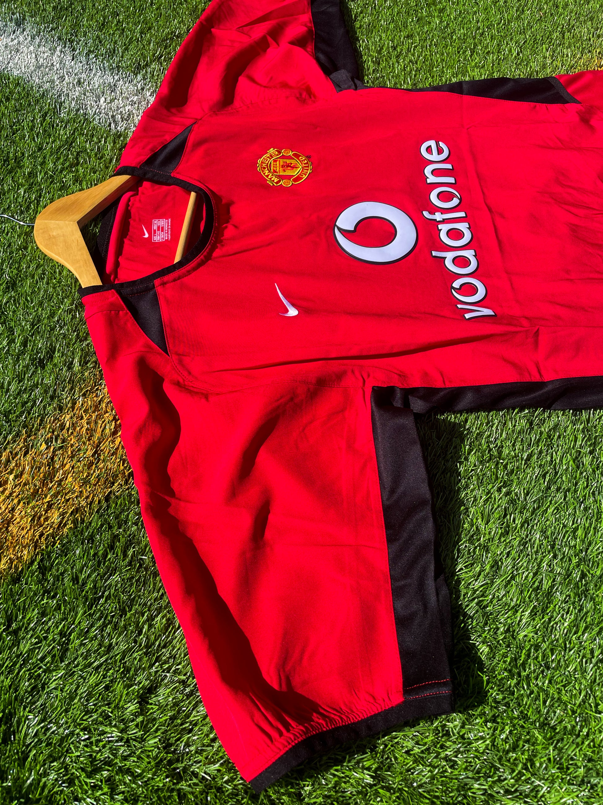 Close-up of embroidered club crest and Nike swoosh

