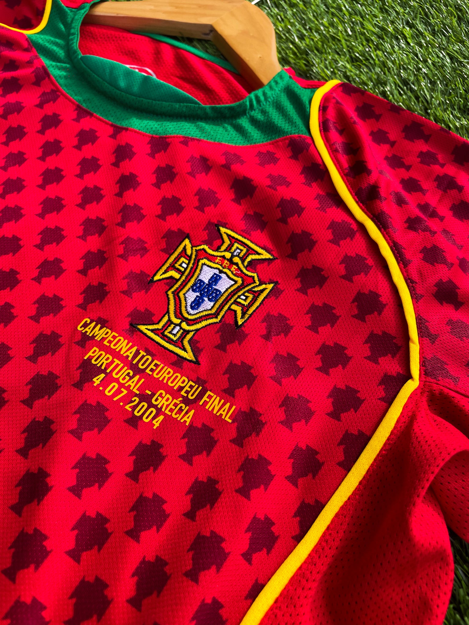 Close-up of Nike swoosh and Portuguese crest

