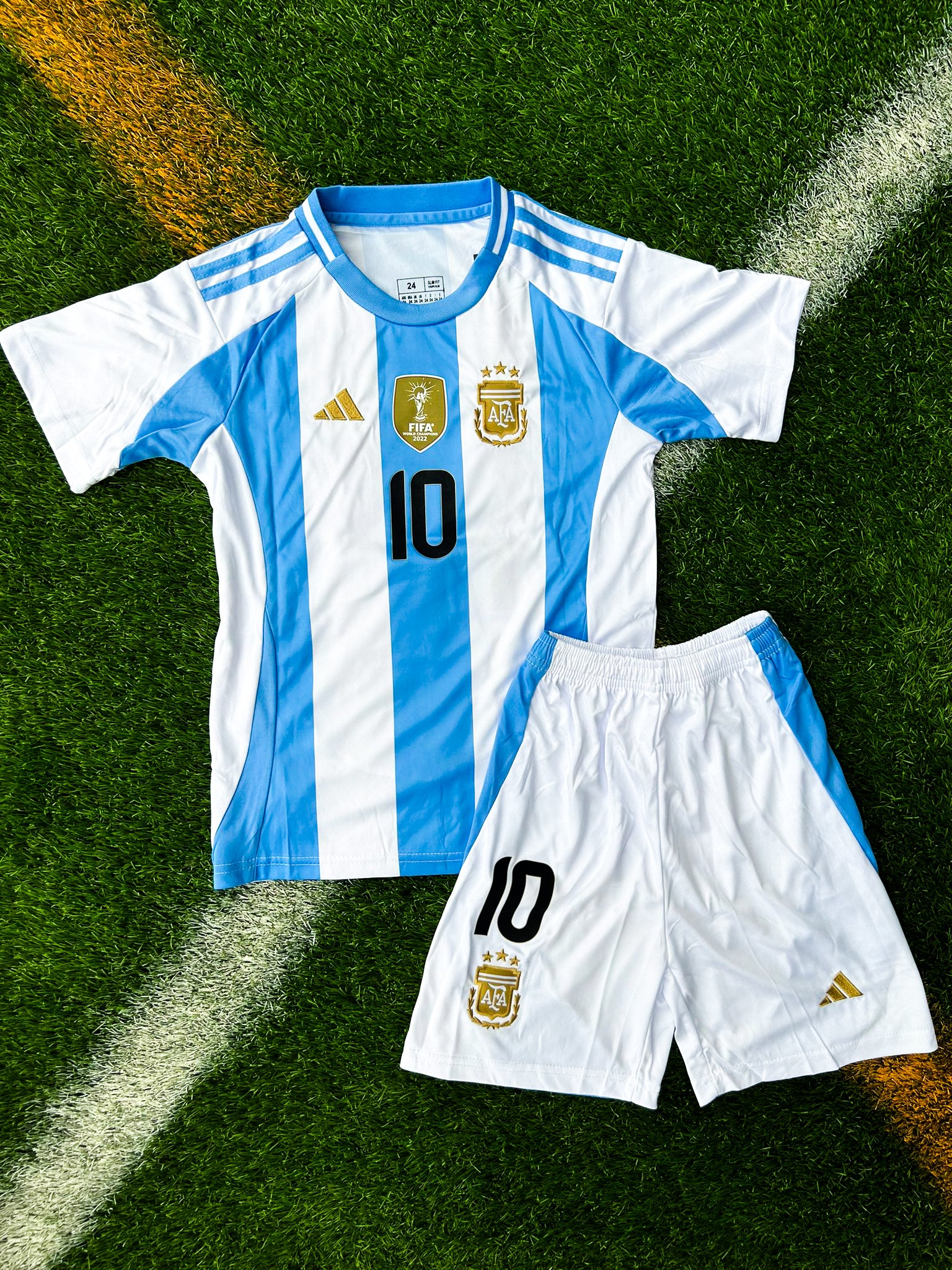 Front view of Argentina 2024 Home Kids Jersey with sky blue and white stripes and AFA crest.