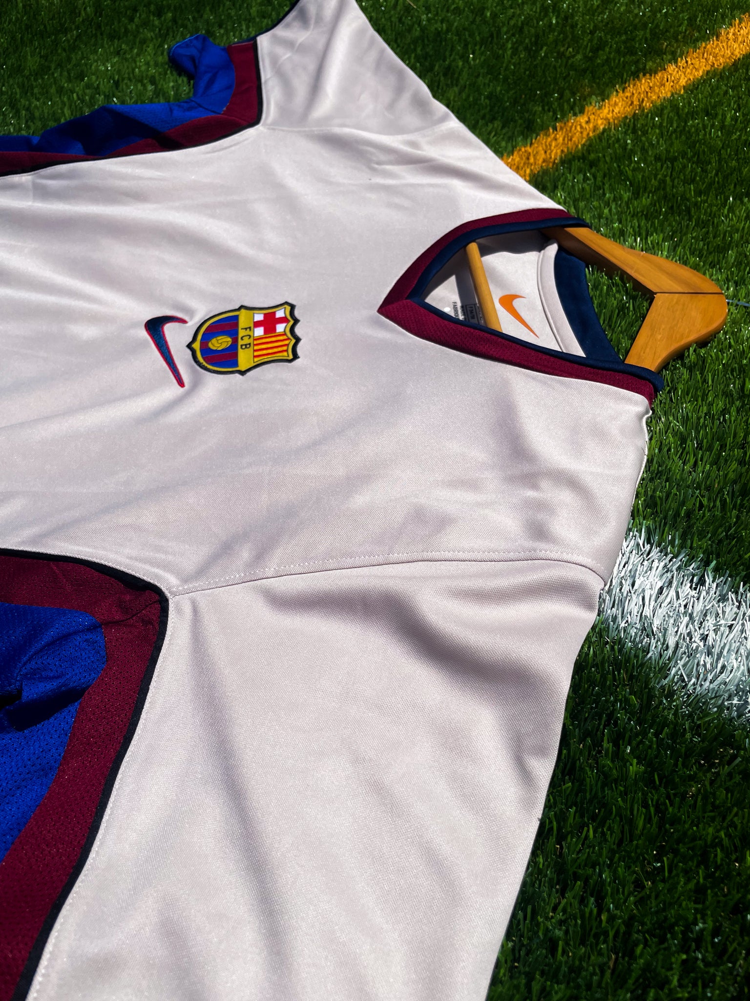 Close-up of Nike swoosh and Barcelona crest embroidery

