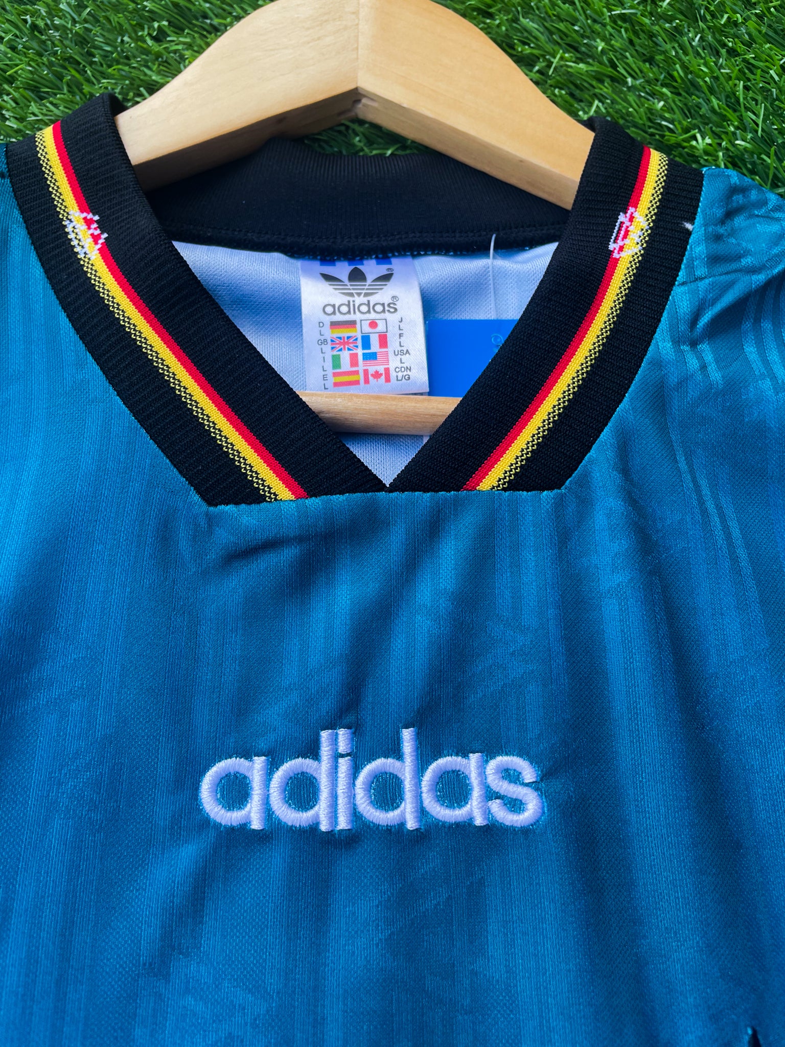 Close-up of DFB crest and Adidas logo

