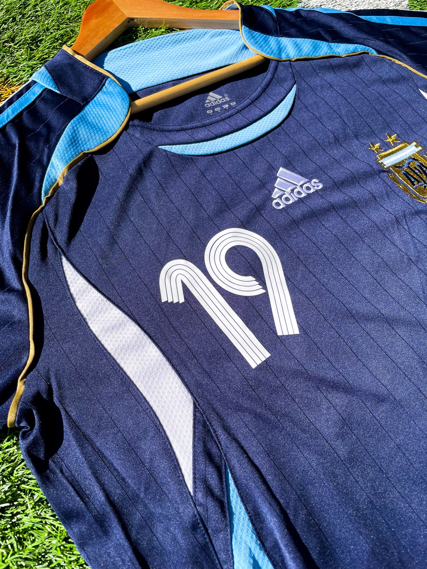 Detailed shot of the jersey's fabric texture and sky blue accents.