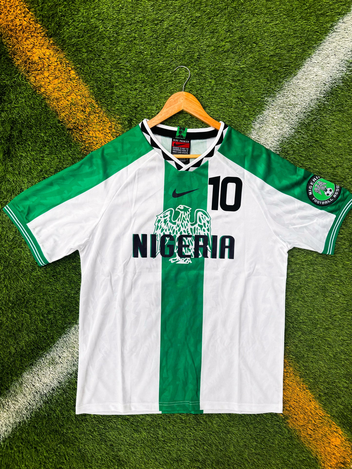 Front of Nigeria 1996 away jersey with green accents on a white base

